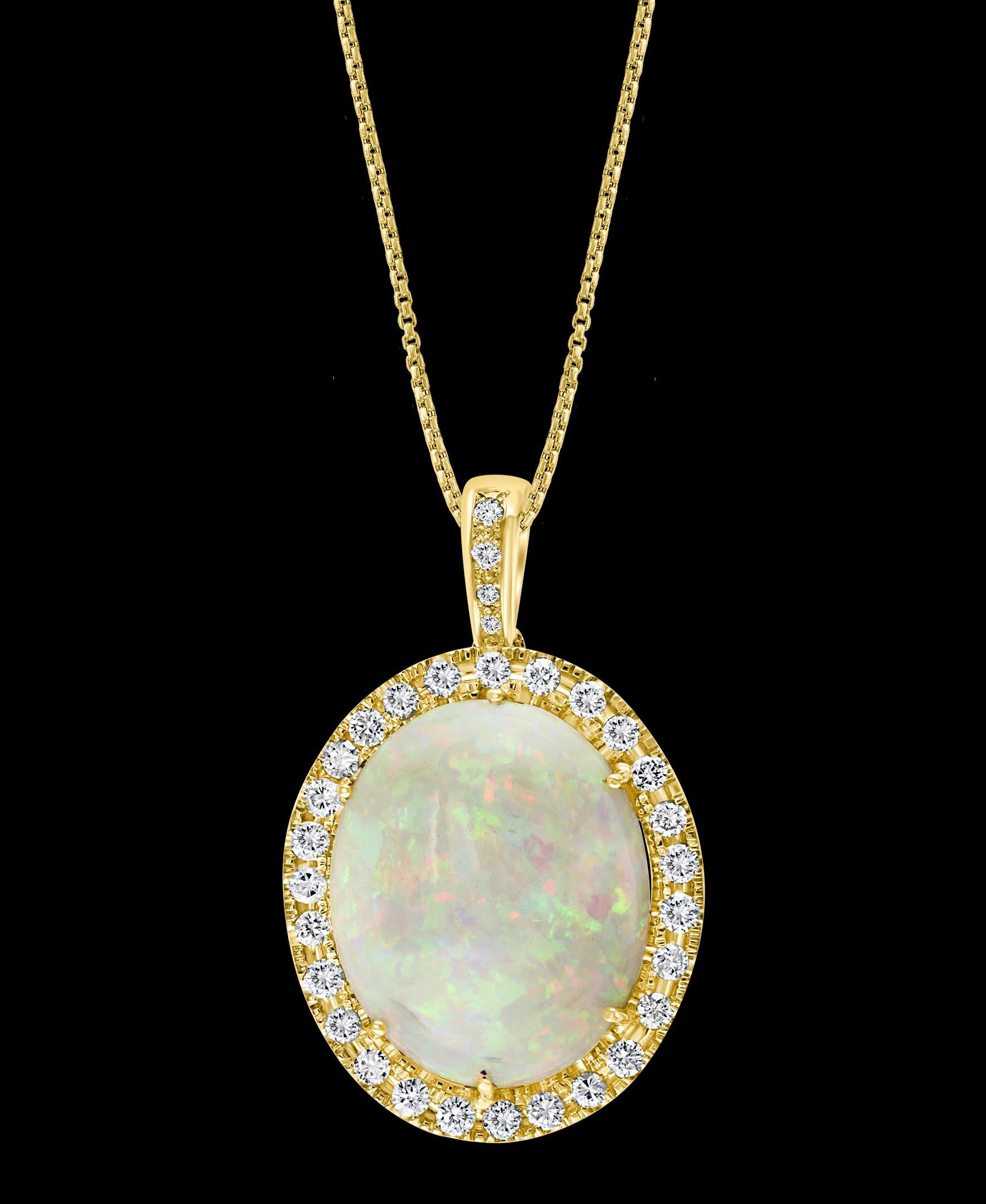 52.70 Carat Oval Ethiopian Opal & Diamond Pendant / Necklace 18 Karat Gold Estate yellow Gold 
This spectacular Pendant Necklace consisting of a single Oval Shape Ethiopian Opal Approximately 52.70 Carat. The Opal is surrounded by approximately 3.6