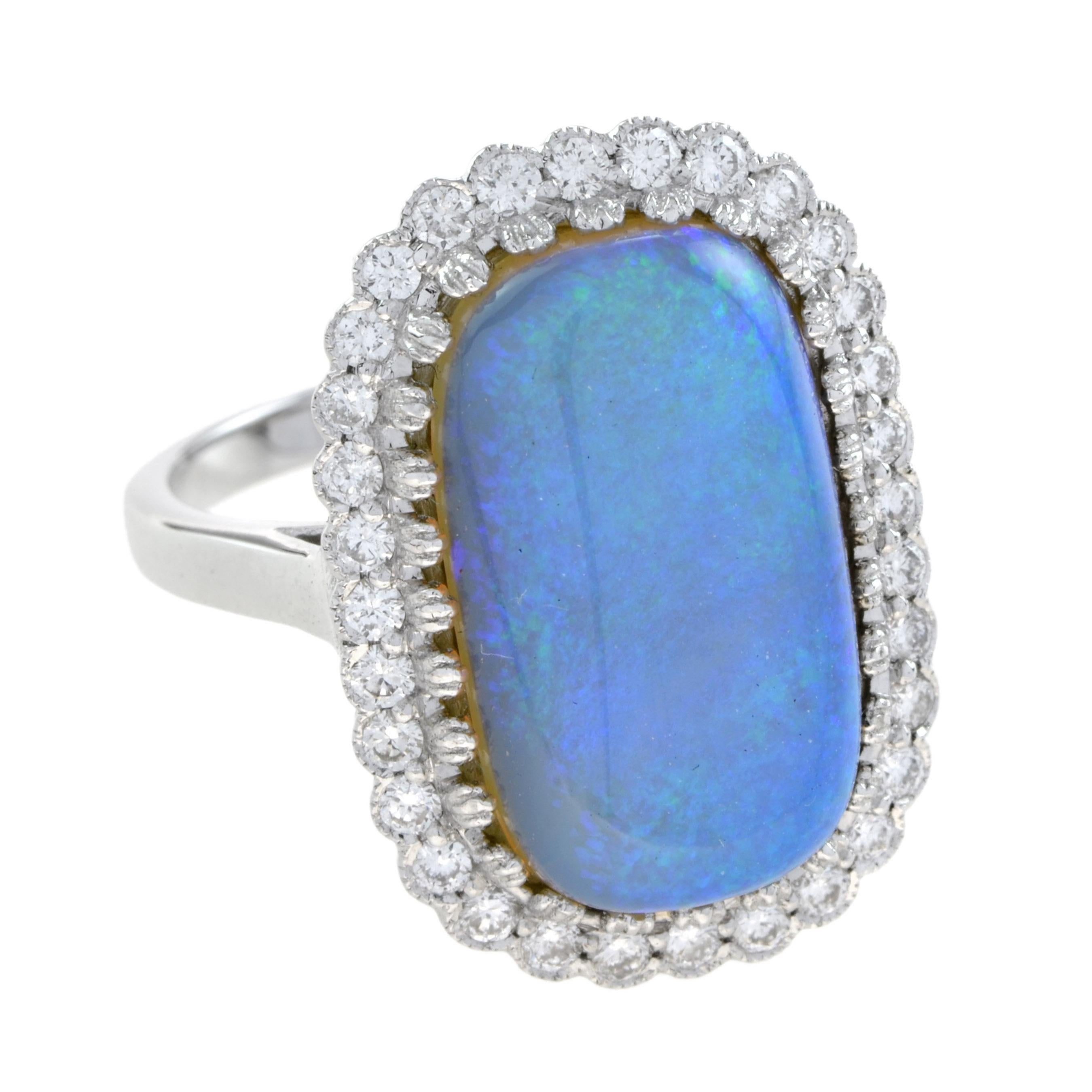 Curate your collection of classic accessories with this gorgeous opal and diamond ring. Fashioned in 18k white gold, this sublime look showcases a 5.20 carat crystal Australian cushion-shaped opal cabochon. The frame sparkles with H/SI grade