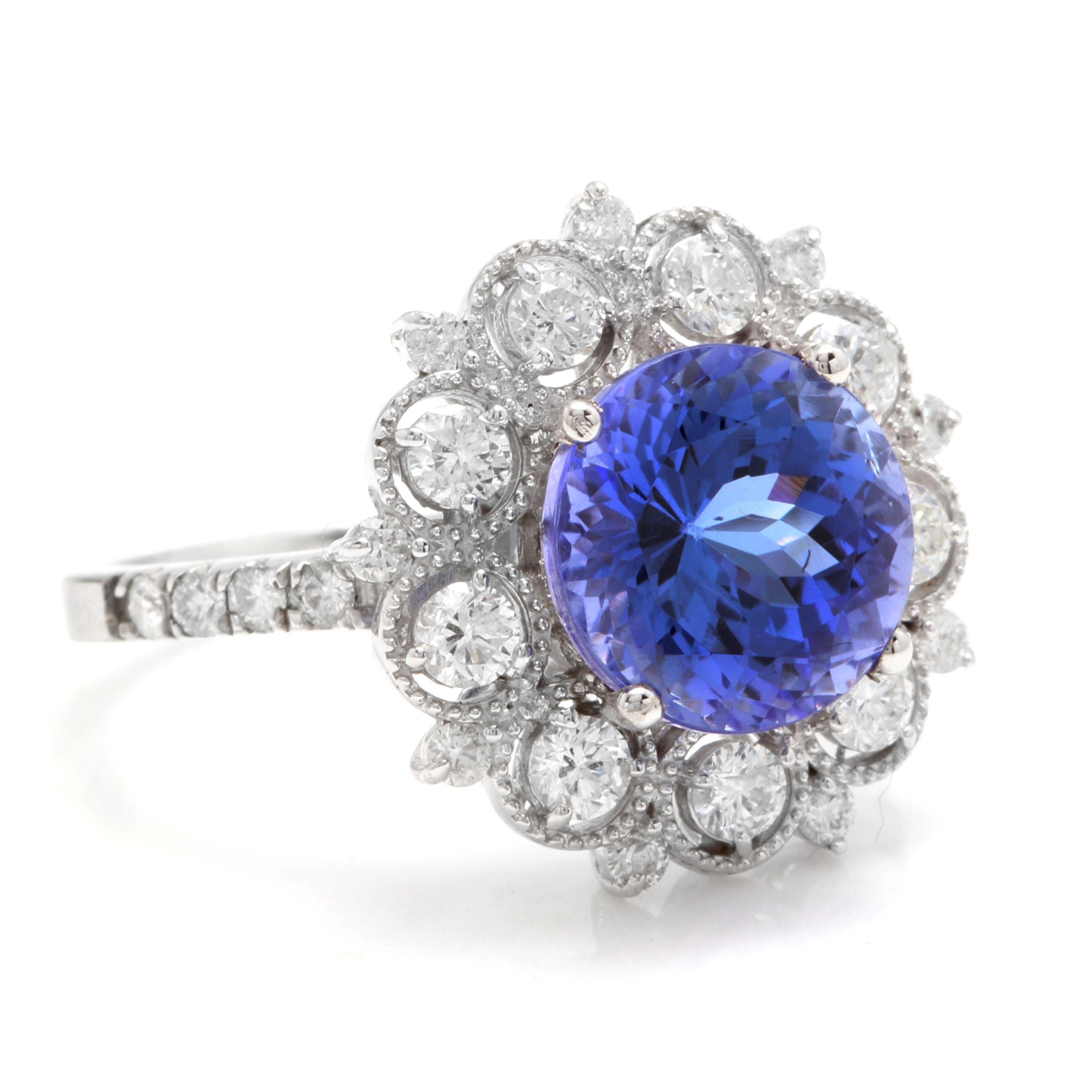 5.20 Carats Natural Very Nice Looking Tanzanite and Diamond 14K Solid White Gold Ring

Total Natural Round Cut Tanzanite Weight is: Approx. 4.00 Carats

Tanzanite Measures: Approx. 9.30mm

Natural Round Diamonds Weight: Approx. 1.20 Carats (color