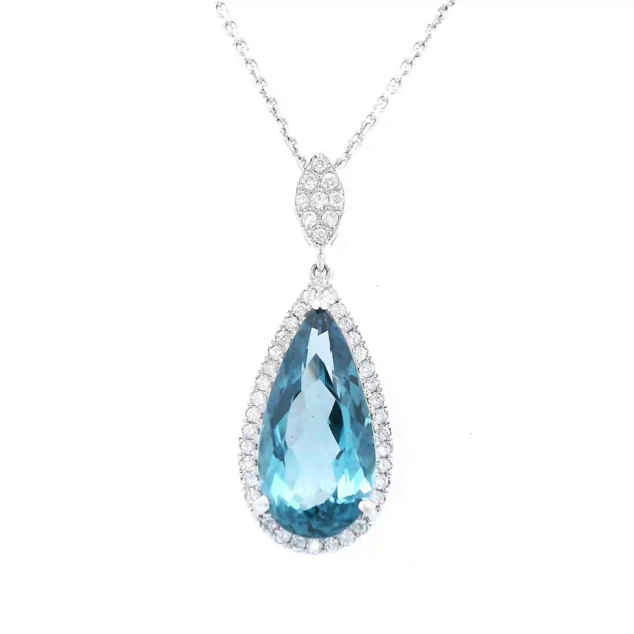 Stunning London blue topaz pendant necklace.
5.44 carats total gemstone weight.
5.20 carat pear London blue topaz. 45 round brilliant diamonds, 0.24 carats. Approximately G color and VS2 clarity. 14-karat white gold, 4.31 grams, 18