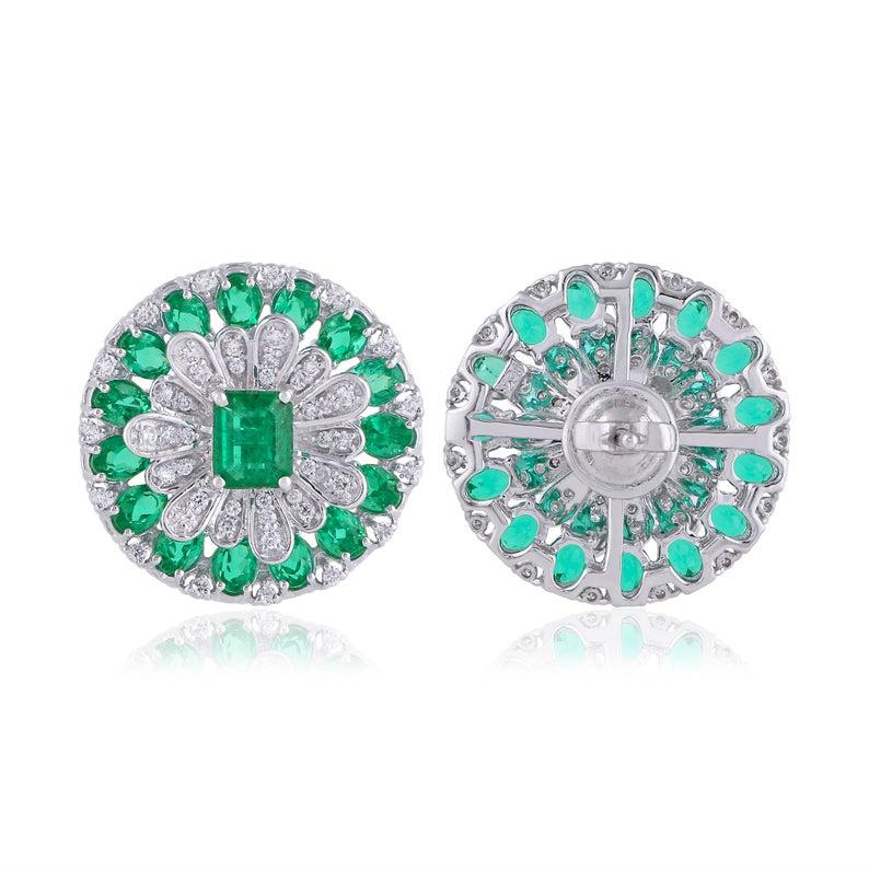Cast in 14 karat gold, these stud earrings are hand set with 5.21 carats emerald and .70 carats of glimmering diamonds. 

FOLLOW MEGHNA JEWELS storefront to view the latest collection & exclusive pieces. Meghna Jewels is proudly rated as a Top