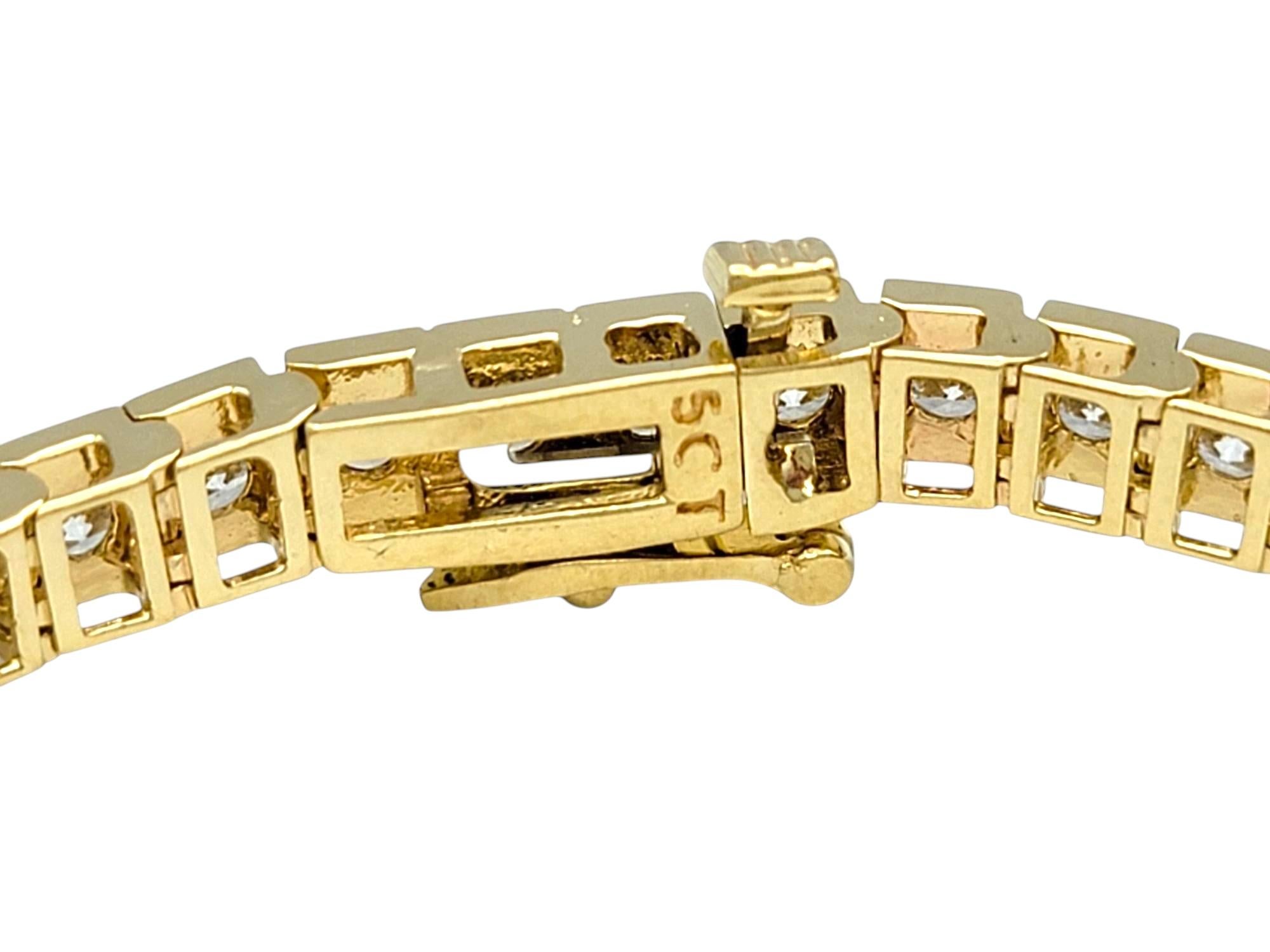 Women's 5.21 Carat Total Channel Set Round Diamond Tennis Bracelet 14 Karat Yellow Gold For Sale