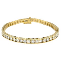Bracciale tennis con diamanti rotondi incastonati a canale da 5,21 carati totali, oro giallo 14 carati