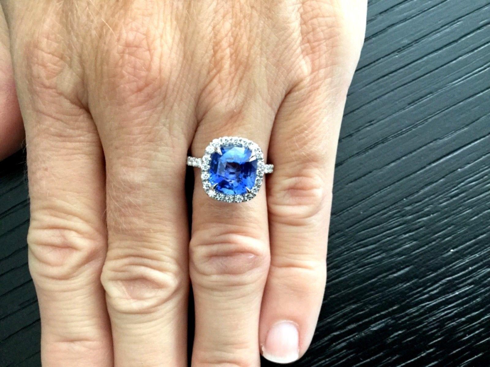 MAJOR PRICE REDUCTION!  MAKING ROOM FOR NEW INVENTORY!

For your consideration is a 5.21 carat Cushion cut, UNHEATED natural, transparent, blue Sri Lankan sapphire set in a brand new 14k white gold setting with approximately .59 carats of natural G