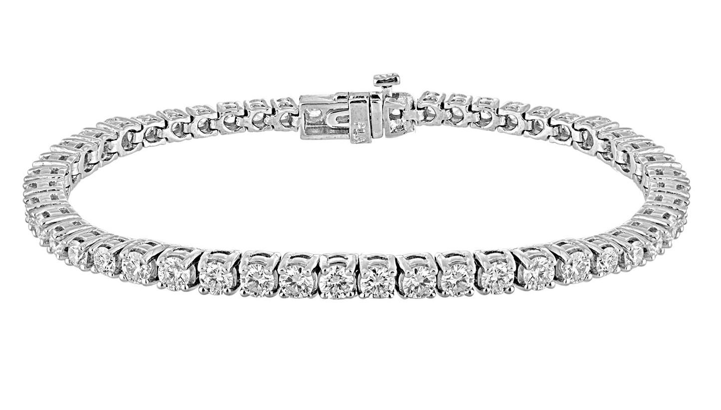 51 White Diamonds totaling 5.22 Carats are set in White Gold Bracelet. 
It is your classic Tennis Bracelet.