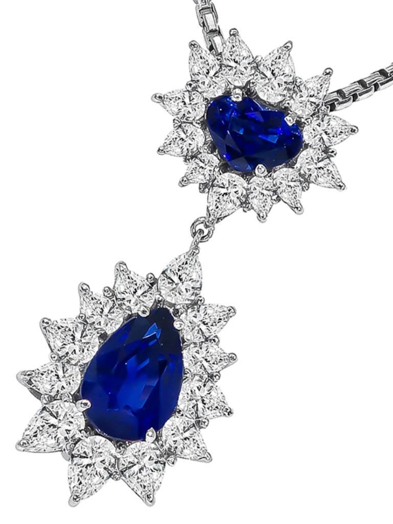 This elegant 18k white gold pendant necklace is set with lovely heart and pear shape sapphires that weigh approximately 5.22ct. The sapphires are accentuated by sparkling pear shape diamonds that weigh approximately 4.50ct. graded H color with