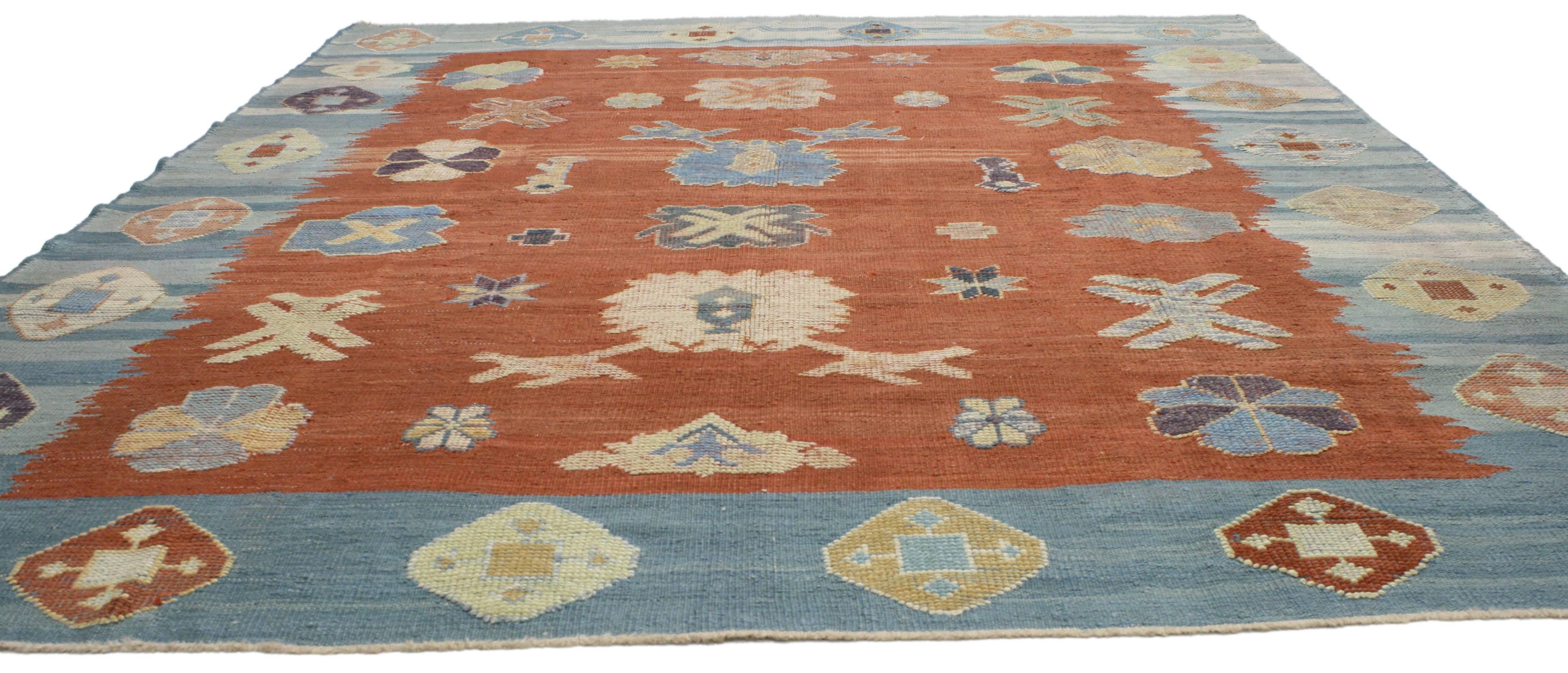 52207 Turkish Kilim rug with tribal style. Blue and orange Turkish Kilim rug with tribal style. This Turkish Kilim rug has a distinctly tribal style with geometric shapes galore. The dark orange and blue hues give it a warm, inviting feel and