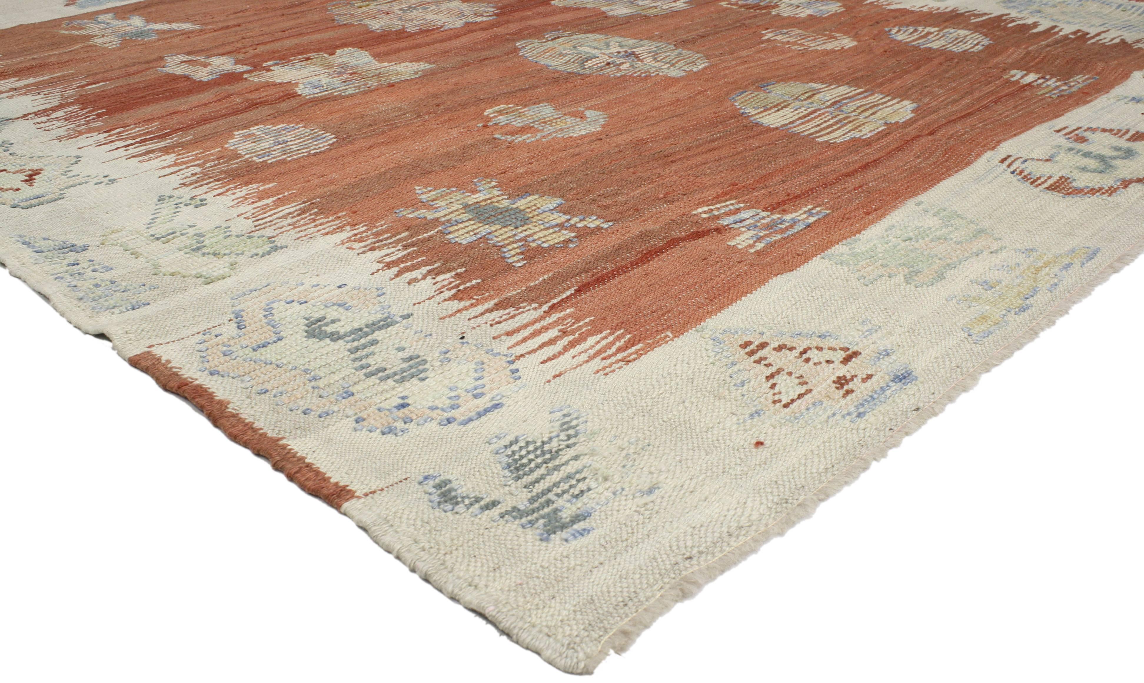 52208 Turkish Kilim rug with tribal style. Providing elements of wanderlust and functional versatility, this Turkish Kilim rug with tribal style features a diversity of symbolic Turkish motifs on an abrashed rustic umber field surrounded by a
