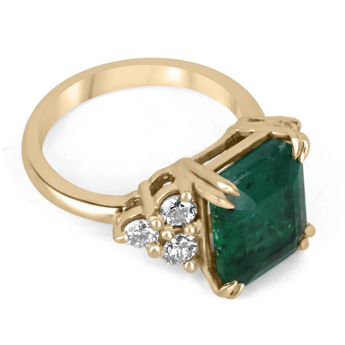 An iconic emerald and diamond engagement, right hand, or statement ring. The center stone features a large 4.52-carat emerald cut, emerald with stunning qualities; a deep green color, beautiful freckled clarity, and luster. Carefully double