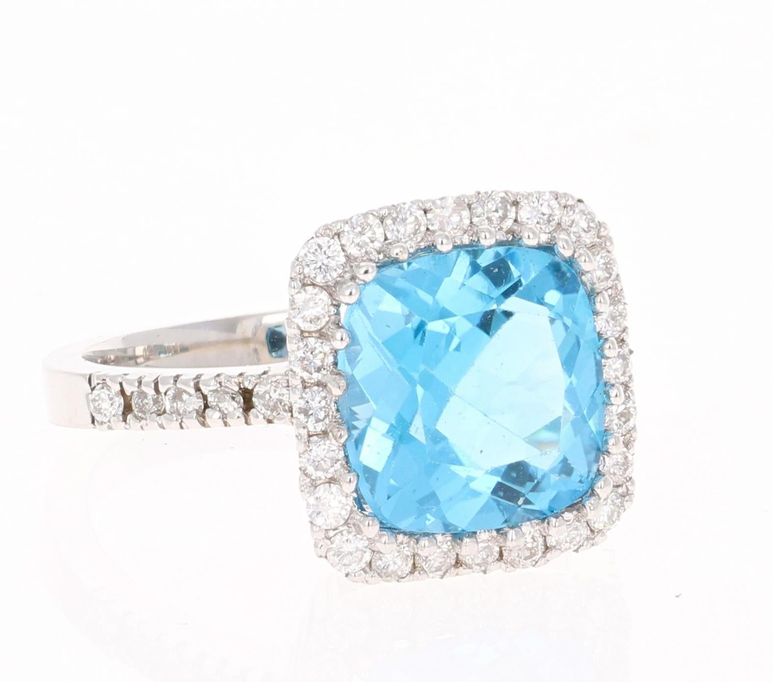 An affordable and pretty alternative to the traditional Engagement Ring!

This ring has a beautiful Cushion cut Blue Topaz weighs 4.68 Carats.  It is surrounded by 34 Round Cut Diamonds that weigh 0.55 Carats (Clarity: SI, Color: F). The total carat