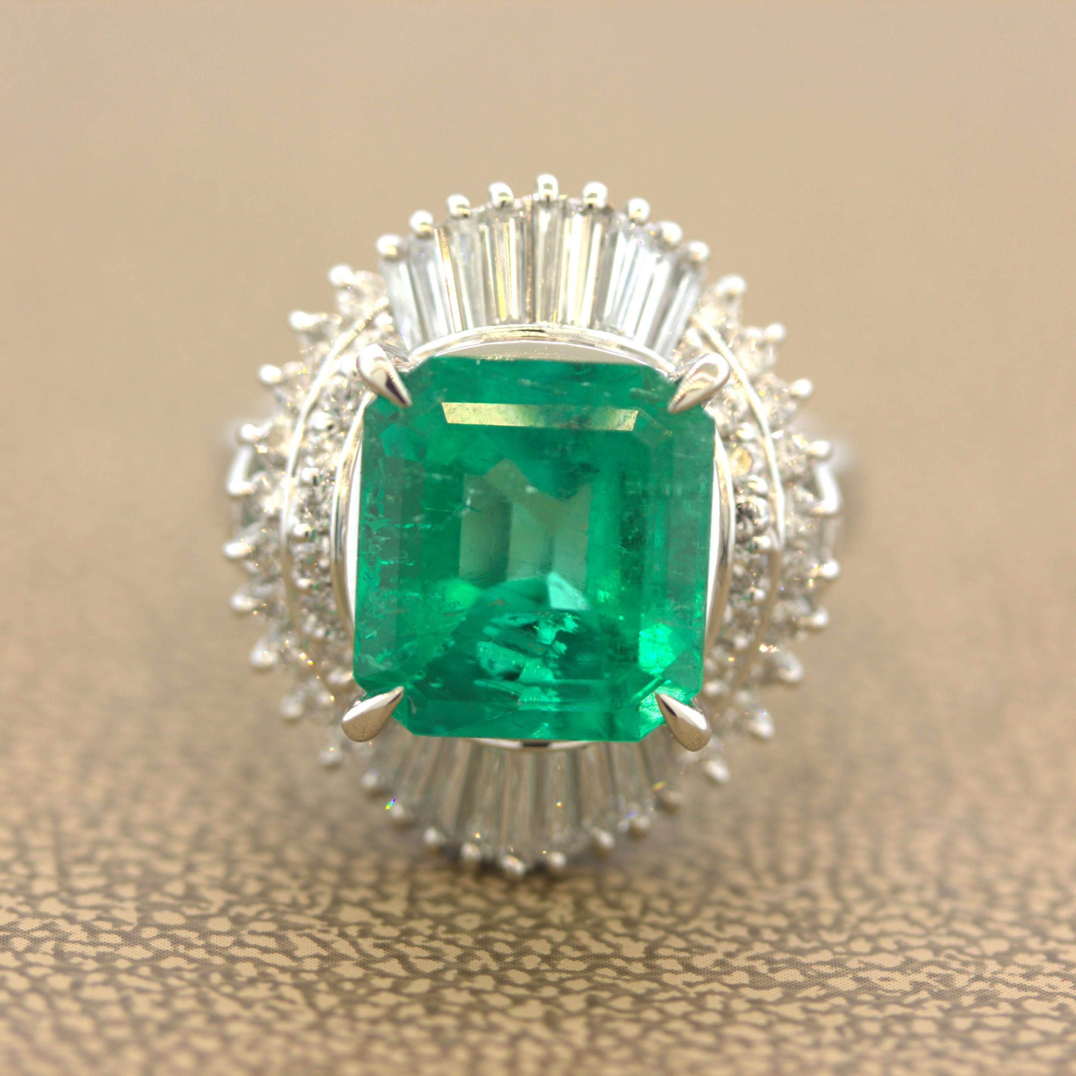 A richly colored gem emerald weighing 5.23 carats takes center stage. Due to its strong color and internal features we strongly believe this stone is from Colombia. It has a rich green color while still maintaining a bright and lively crystal. It is
