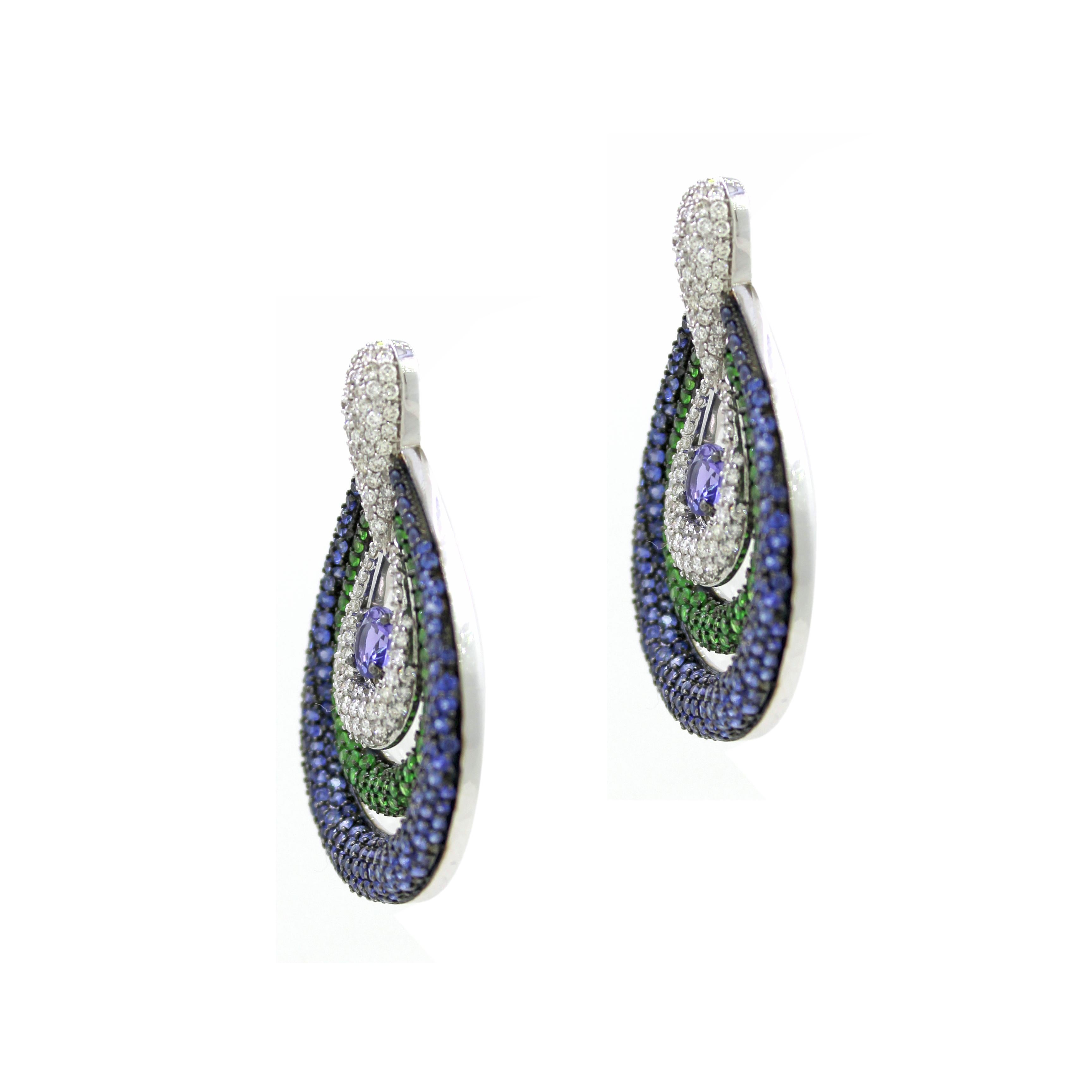 Introducing our stunning Drop Earrings, a breathtaking fusion of vibrant colors and exquisite craftsmanship. These beautiful earrings feature 164 tsavorites totaling 1.47 carats and 358 blue sapphires totaling 3.76 carats, creating a mesmerizing