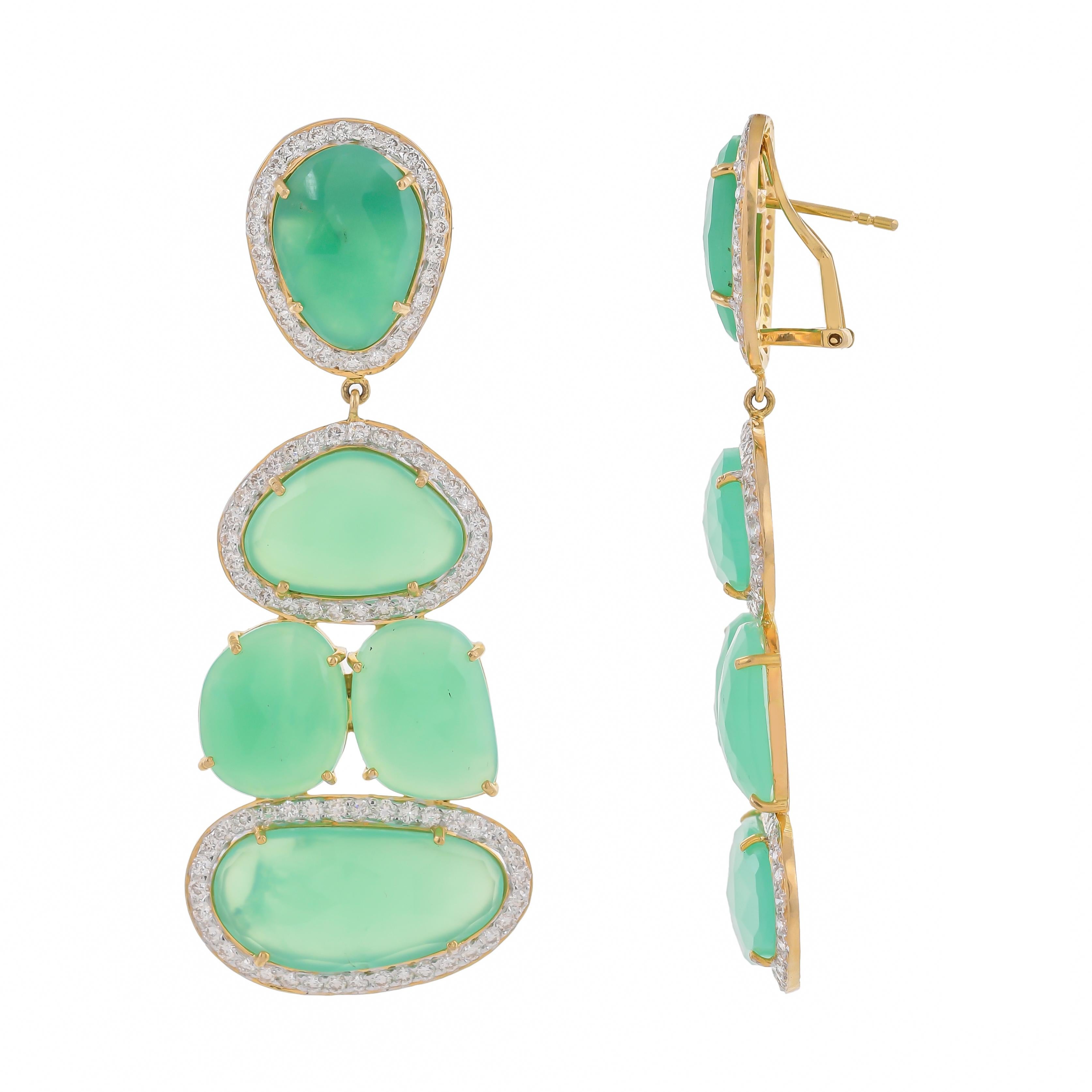 These bold and distinctive earrings feature soft green chrysoprase weighing approximately 52.36 carats which are highlighted with 3.46 carats sparkling diamonds mounted in 18 karats gold. These impressive Italian earrings are an exceptional quality