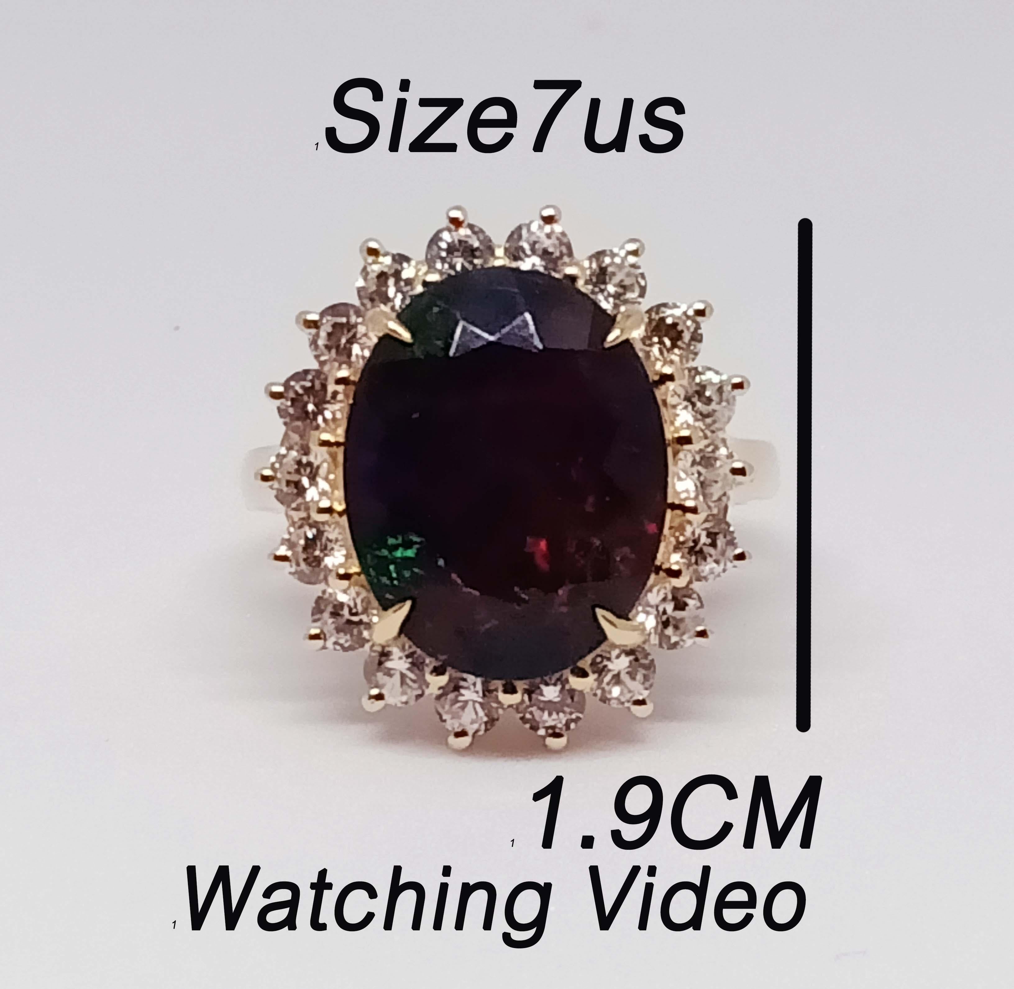 Black Opal Oval size 14.5x11.4 mm.  5.23cts.  
White Zircon 2.5 mm. 18 pcs.
Sterling Silver in 18K Gold Plated. 
Ring size 7 us.

