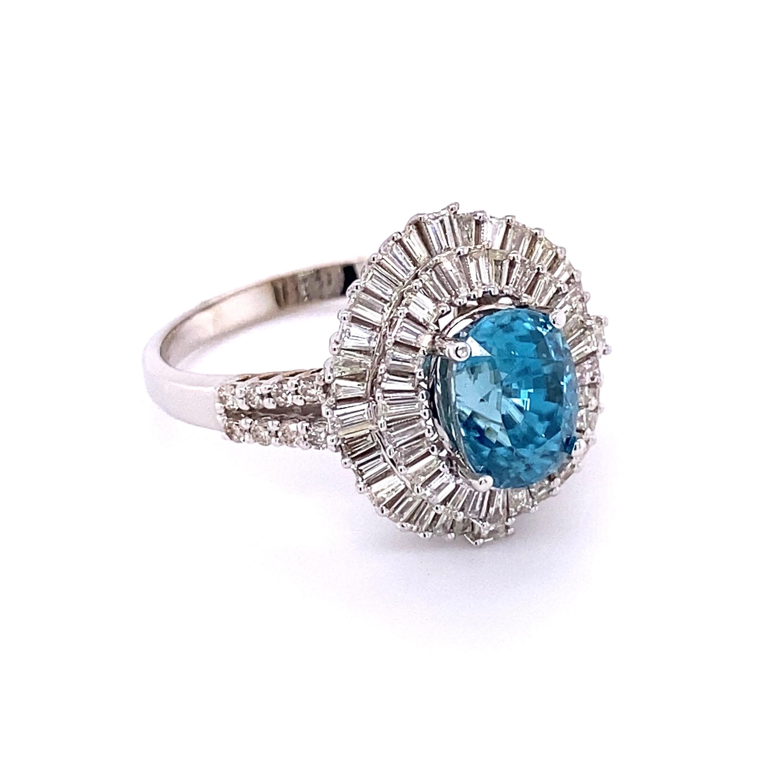 Simply Beautiful and finely detailed Blue Zircon and Diamond Cocktail Ring. Center securely set with an awesome 5.24 Carat Blue Zircon surrounded by Baguette Diamonds and round diamonds on either side of shank. Diamonds weighing approx. 1.66tcw.