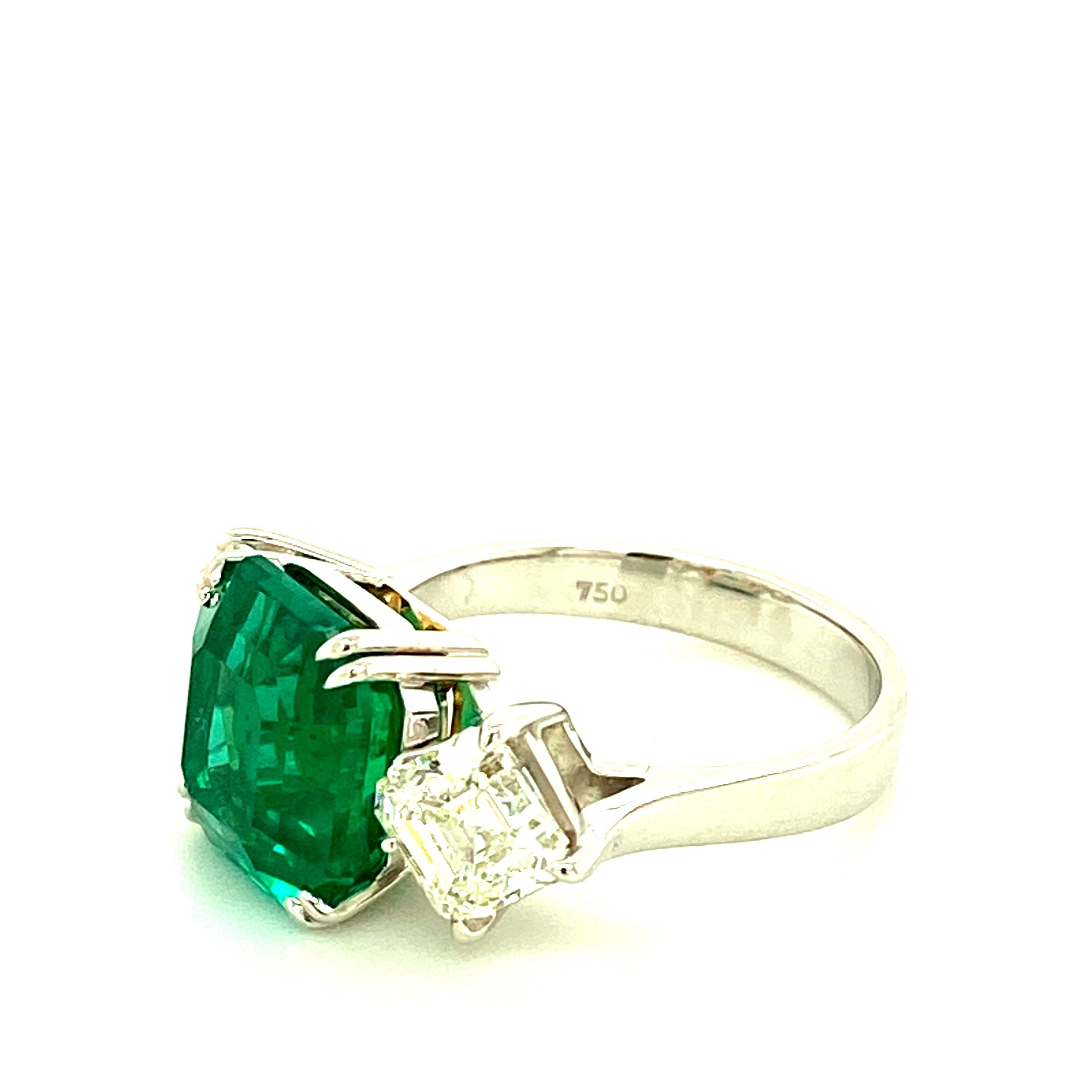 5.24 Carat GRS Certified Octagon Cut Emerald and Diamond Gold Engagement Ring:

A marvellous ring, it features a 5.24 carat GRS certified emerald accented by two asscher cut diamonds on the side weighing a total of 2 carat to form a three-stone