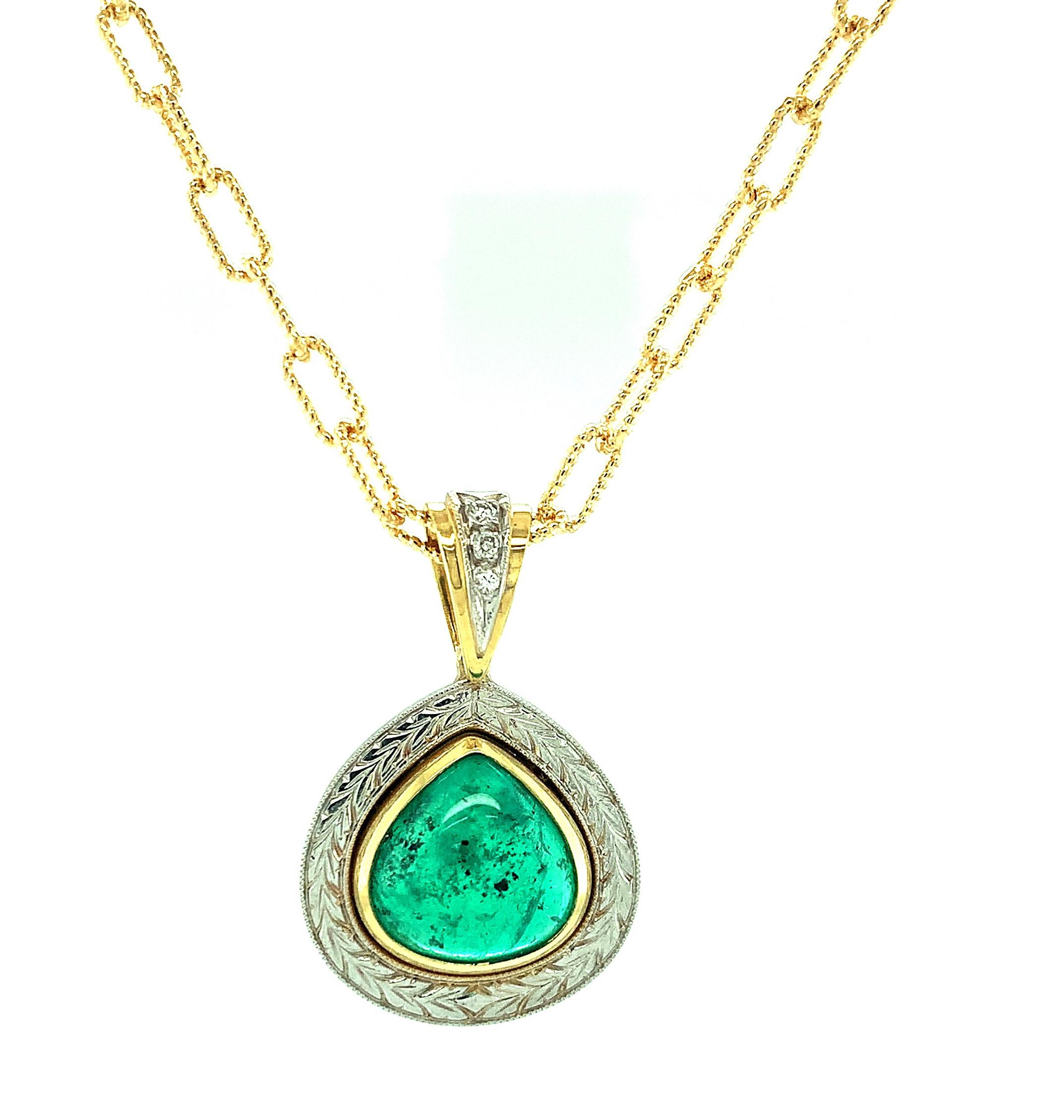 This gorgeous 18k yellow and white gold pendant features an emerald that conjures up images of the  “Emerald City” in The Wizard of Oz!  Cut en-cabochon, it looks like a piece of crystalline candy! This luscious emerald is set in a beautiful,