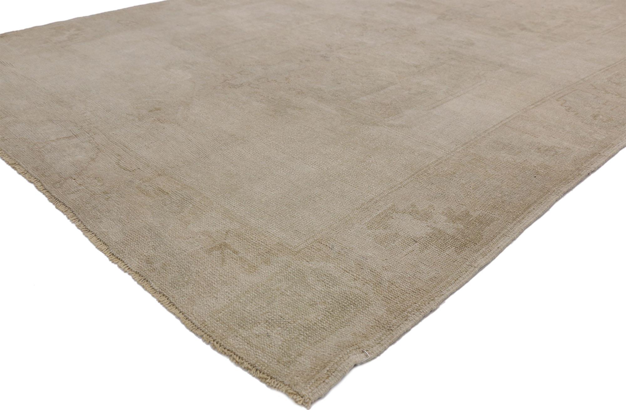 52478 Vintage Turkish Oushak Gallery rug with Rustic style and neutral colors. This hand knotted wool vintage Turkish Oushak rug features three ethereal medallions in an open abrashed field. It is enclosed with a subtle Meander floral border. Warm