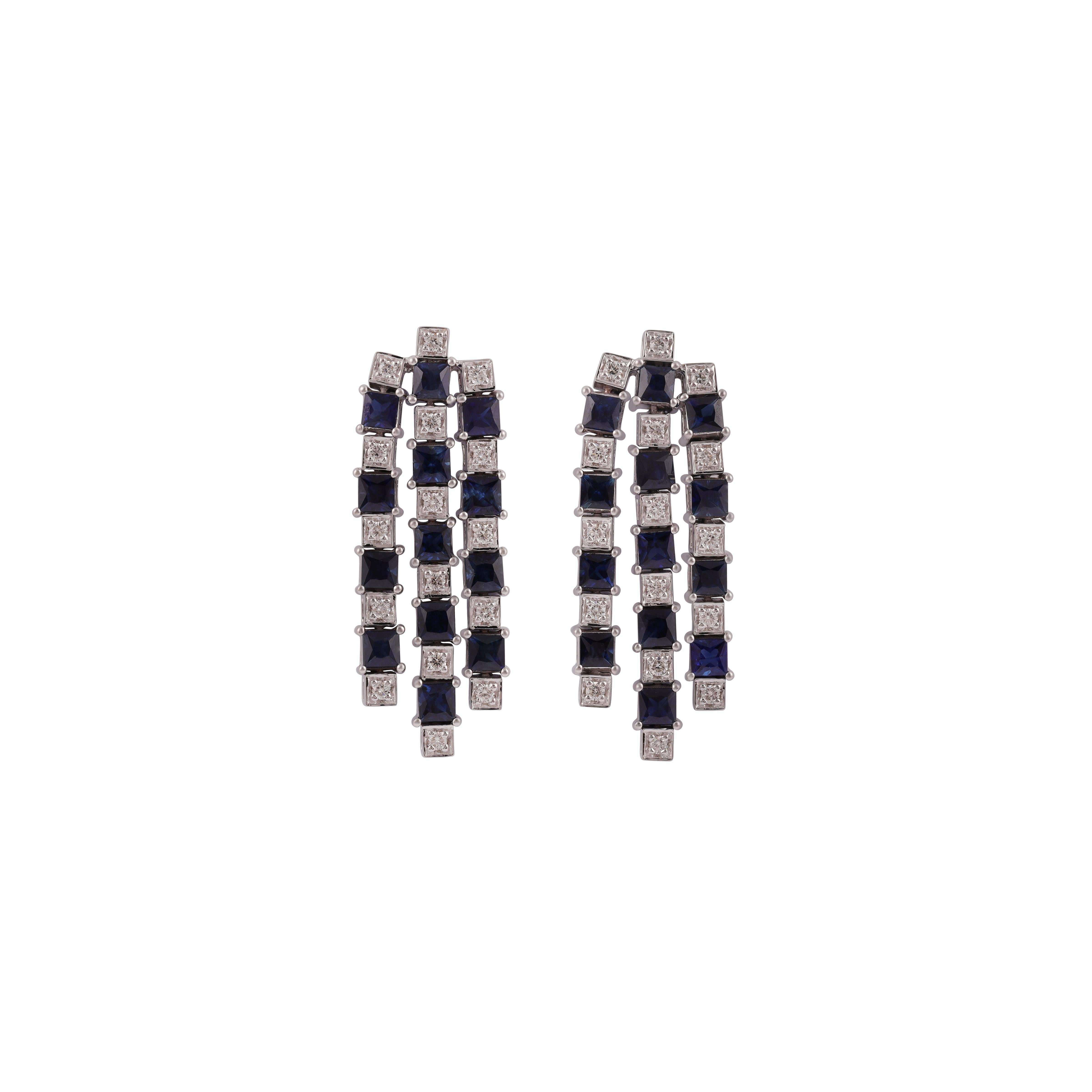 A once in a lifetime pair of earrings...

Made with the highest quality natural diamonds. 18k solid gold.

These earrings are set with Round shaped diamonds weighing 0.54 carat and Blue Sapphire gemstone weighing 5.25 carat. The Round are of HI-SI
