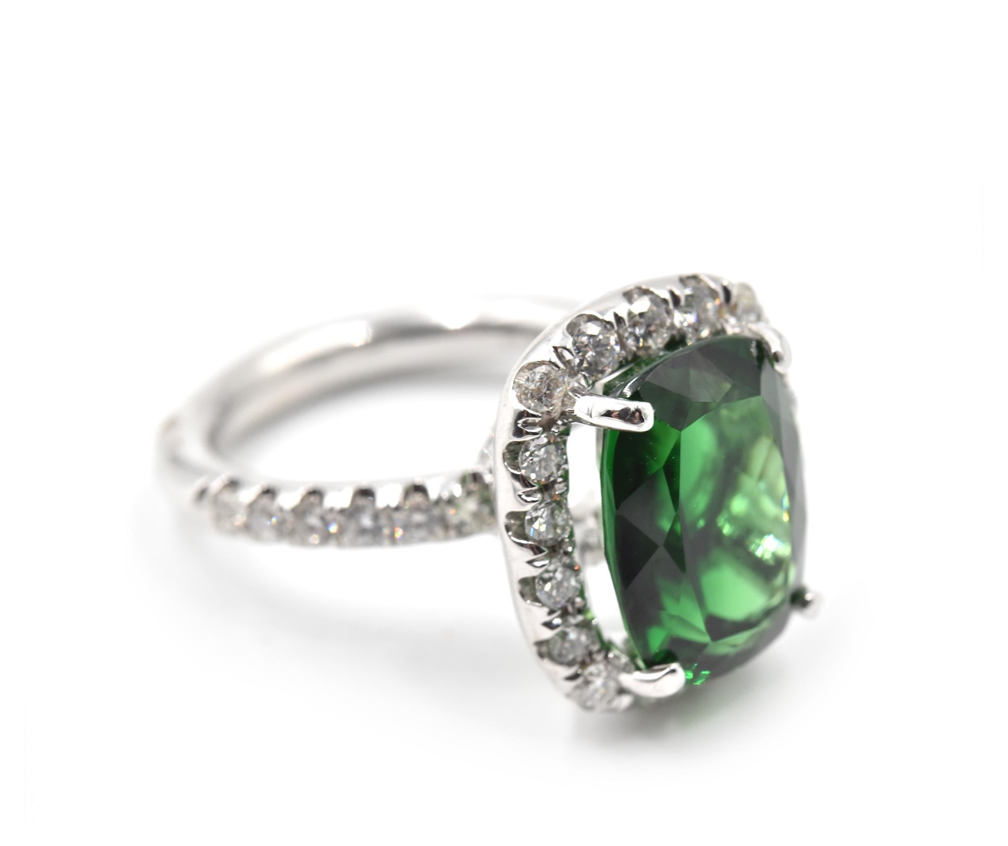 Designer: custom design
Material: 18k white gold
Chrome Tourmaline: one oval cut 5.25 carat
Diamonds: 50 round brilliant cut = 1.09 carat weight
Color: G
Clarity: VS
Ring Size: 6 1/4 (please allow two additional shipping days for sizing
