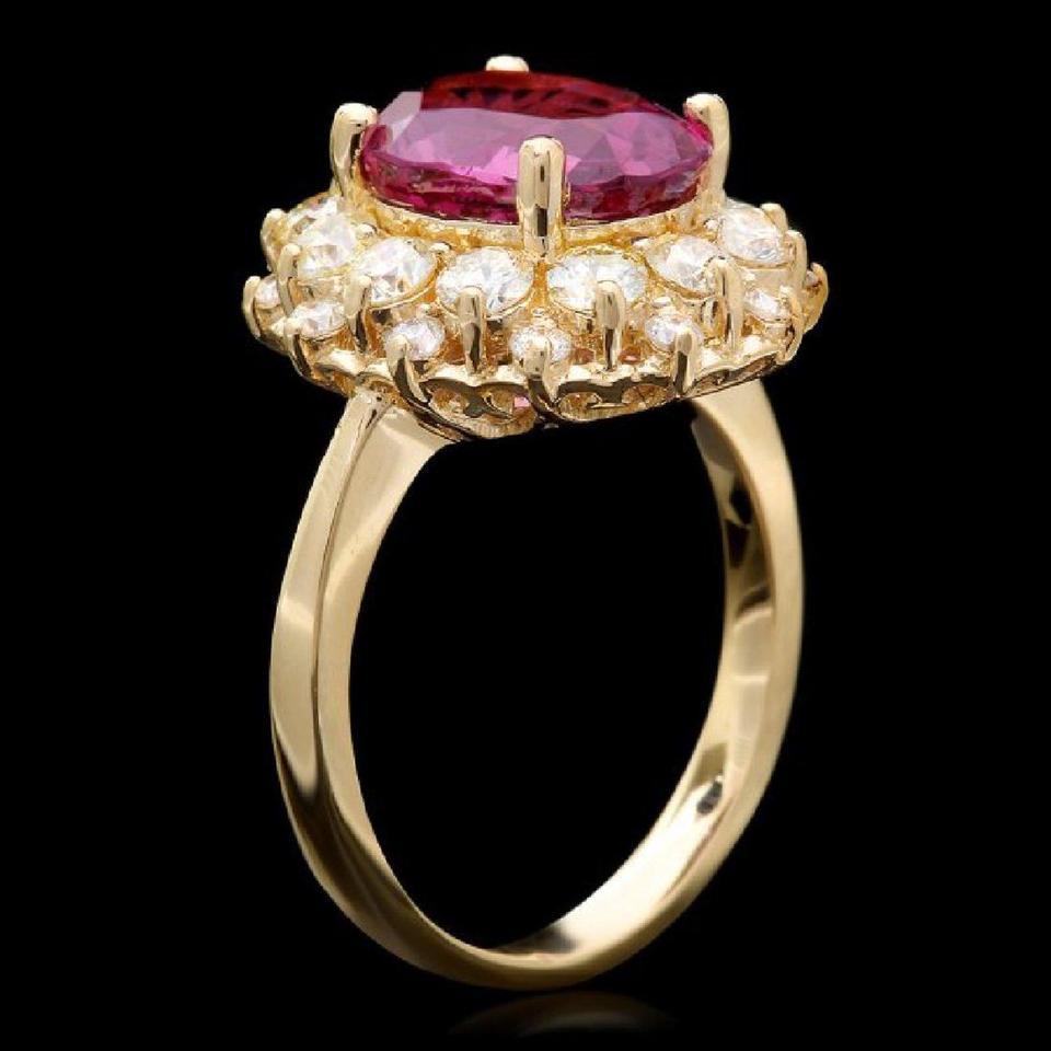 5.25 Carats Natural Very Nice Looking Tourmaline and Diamond 14K Solid Yellow Gold Ring

Total Natural Oval Cut Tourmaline Weight is: Approx. 4.00 Carats (Treatment-Heat)

Tourmaline Measures: Approx. 10.00 x 8.00mm

Natural Round Diamonds Weight:
