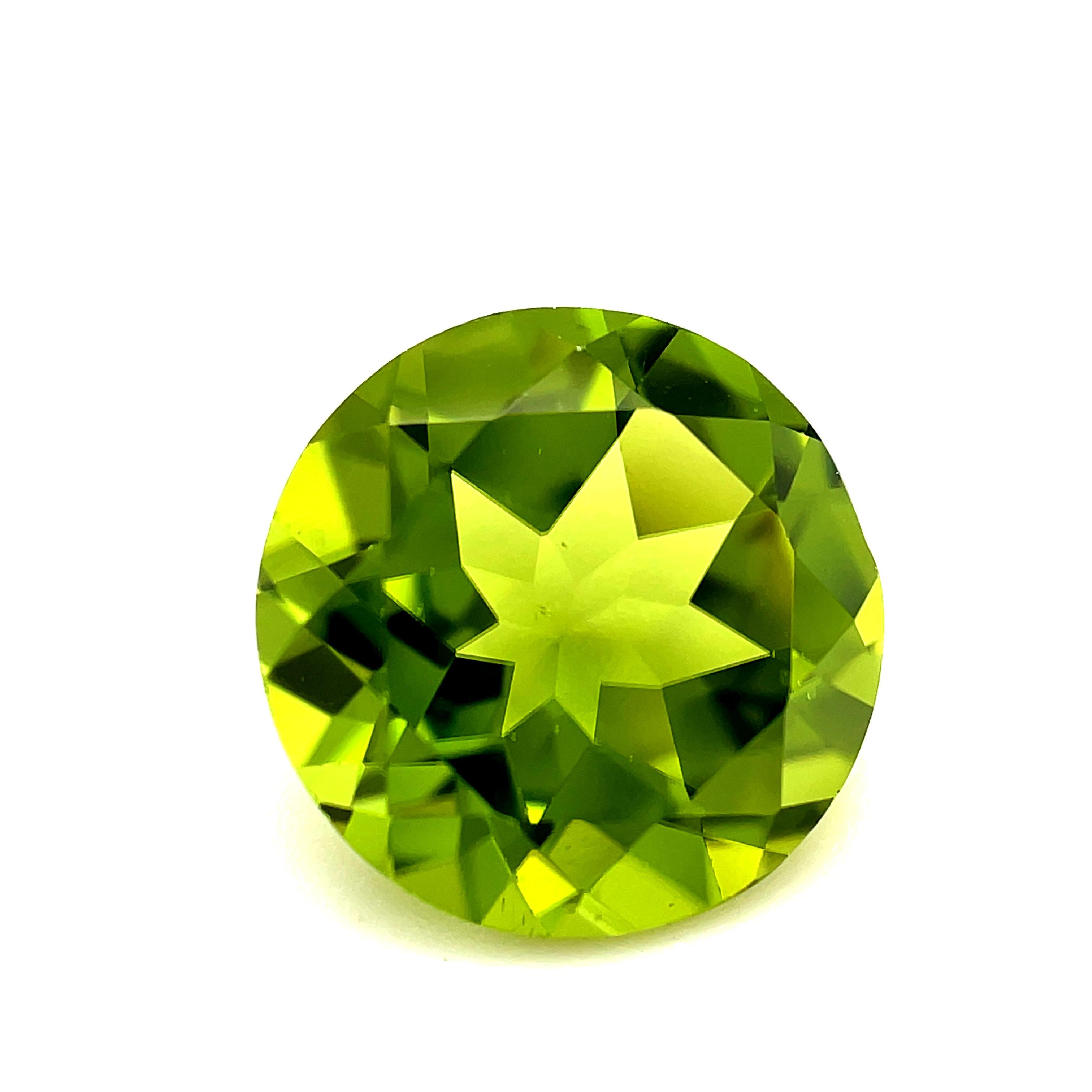 This bright peridot has beautiful, open color and is so lively! It is an ideal apple green color and has exceptional clarity. Measuring 11.02 x 10.97 x 6.25 millimeters, it is a well proportioned, well cut round, offering great versatility for