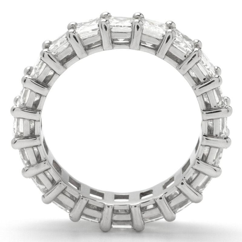 This stunning 14K white gold eternity band features GVS1 emerald-cut diamonds. Weighing in at 5.26 ctw, set with shared prongs, this Eternity Ring gives the effect of an endless sea of diamonds wrapped around your finger. This ring can be worn as a