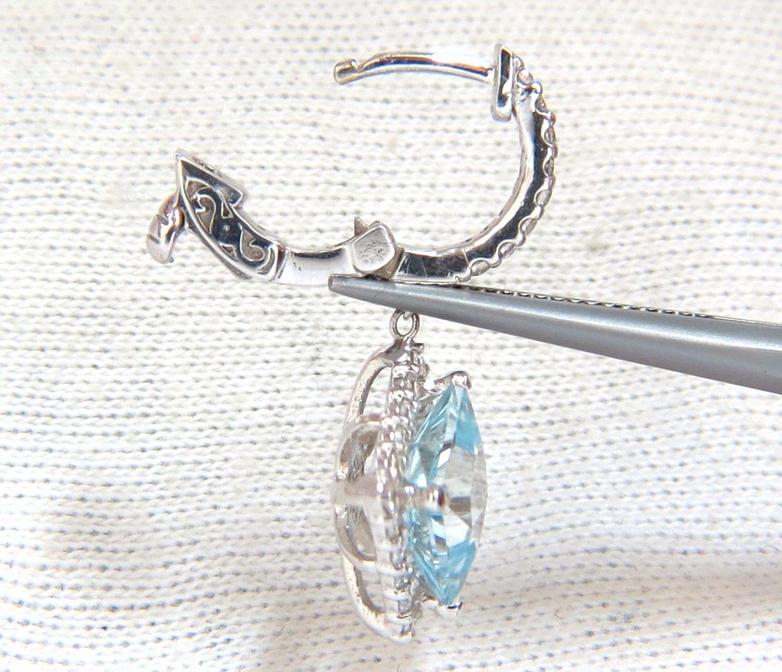 Halo Square Mini Hoop Dangles.

The everyday glamour.

4.40ct. Natural  Light blue aquamarines .

princess cut:

8.10 X 8.10mm

 Transparent & clean clarity.

Bright shines of aqua blues.

.86cts of round diamonds: 

G-color, Vs-2 clarity.

14kt.
