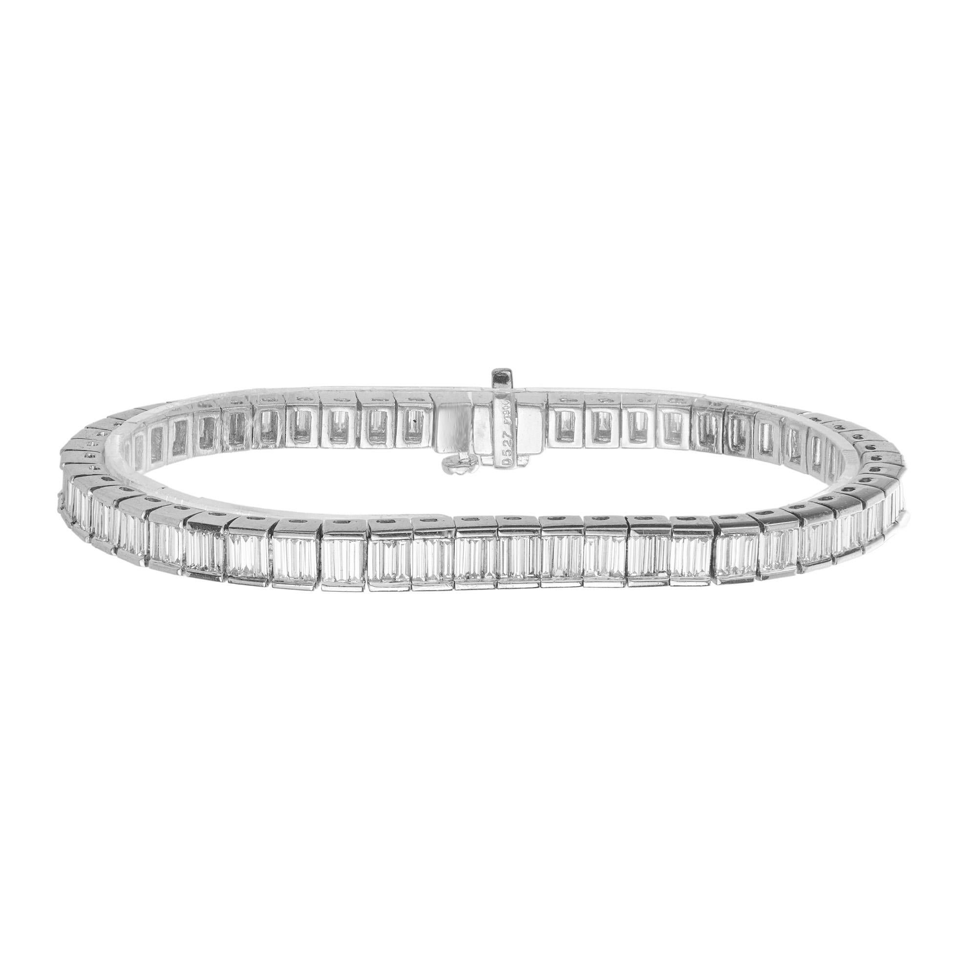 This Diamond tennis bracelet is adorned with 156 emerald cut diamonds totaling 5.27cts in a handmade link bracelet which is complete with a hidden built in catch and underside safety. Imagine the enchanting allure of each emerald cut diamond,