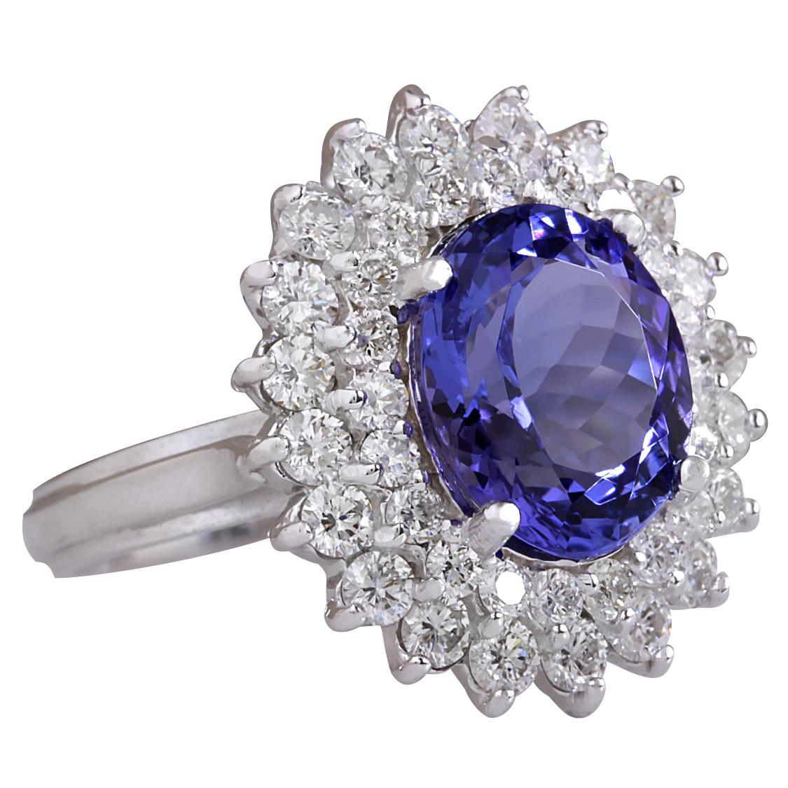 5.27 Carat Natural Tanzanite 14 Karat White Gold Diamond Ring
Stamped: 14K White Gold
Total Ring Weight: 6.5 Grams
Total Natural Tanzanite Weight is 3.82 Carat (Measures: 11.00x9.00 mm)
Color: Blue
Total Natural Diamond Weight is 1.45 Carat
Color: