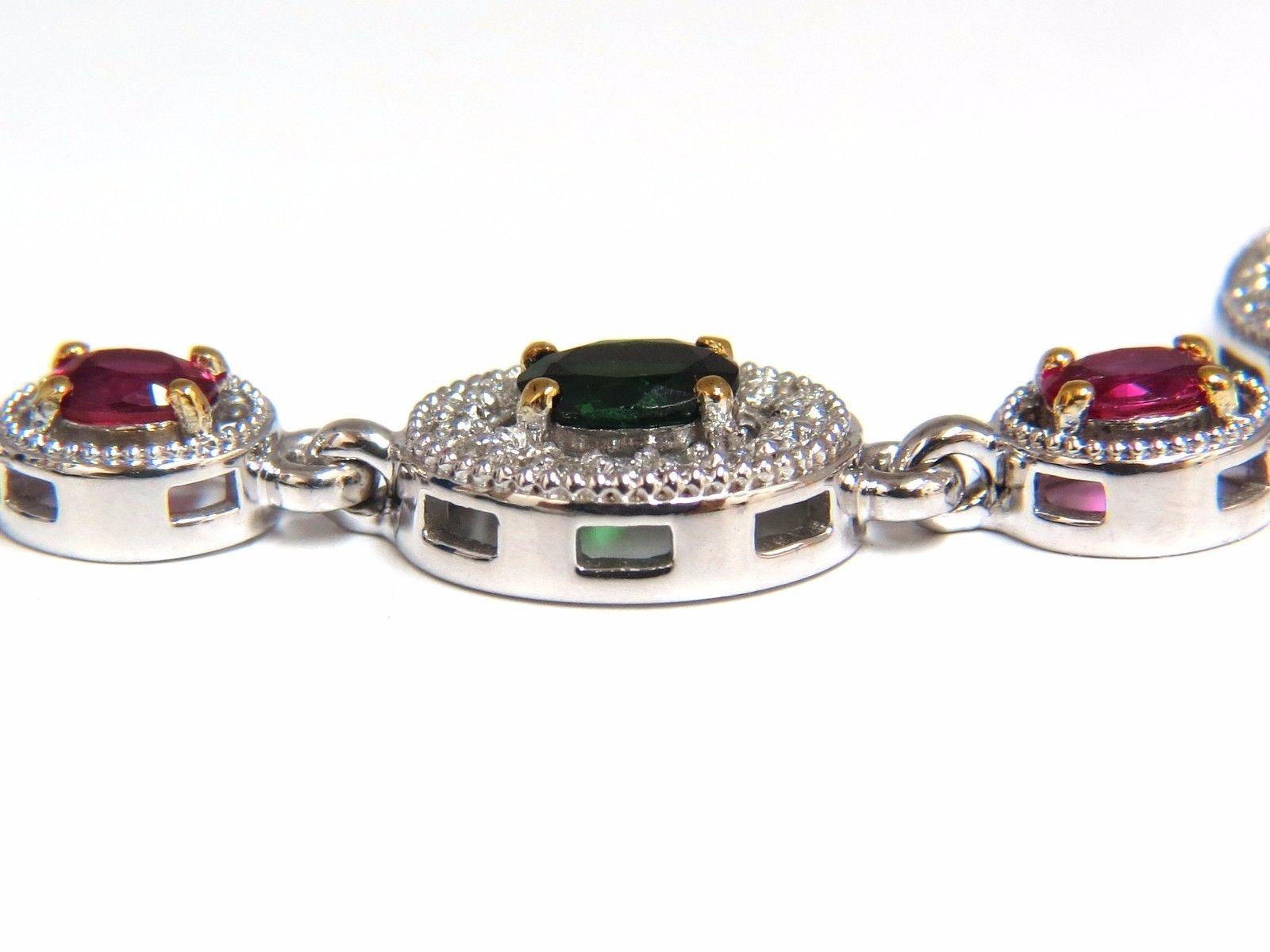 Forest Greens & Vivid Reds

2.67ct. Natural Tsavorites &

1.60ct Rubies Cluster link bracelet.

 

Oval cuts, great sparkle.

Vibrant Greens, reds, excellent sparkle..

Clean Clarity & Transparent.

Tsavorites Average: 4.8 X 3.9mm

Rubies Average: 4