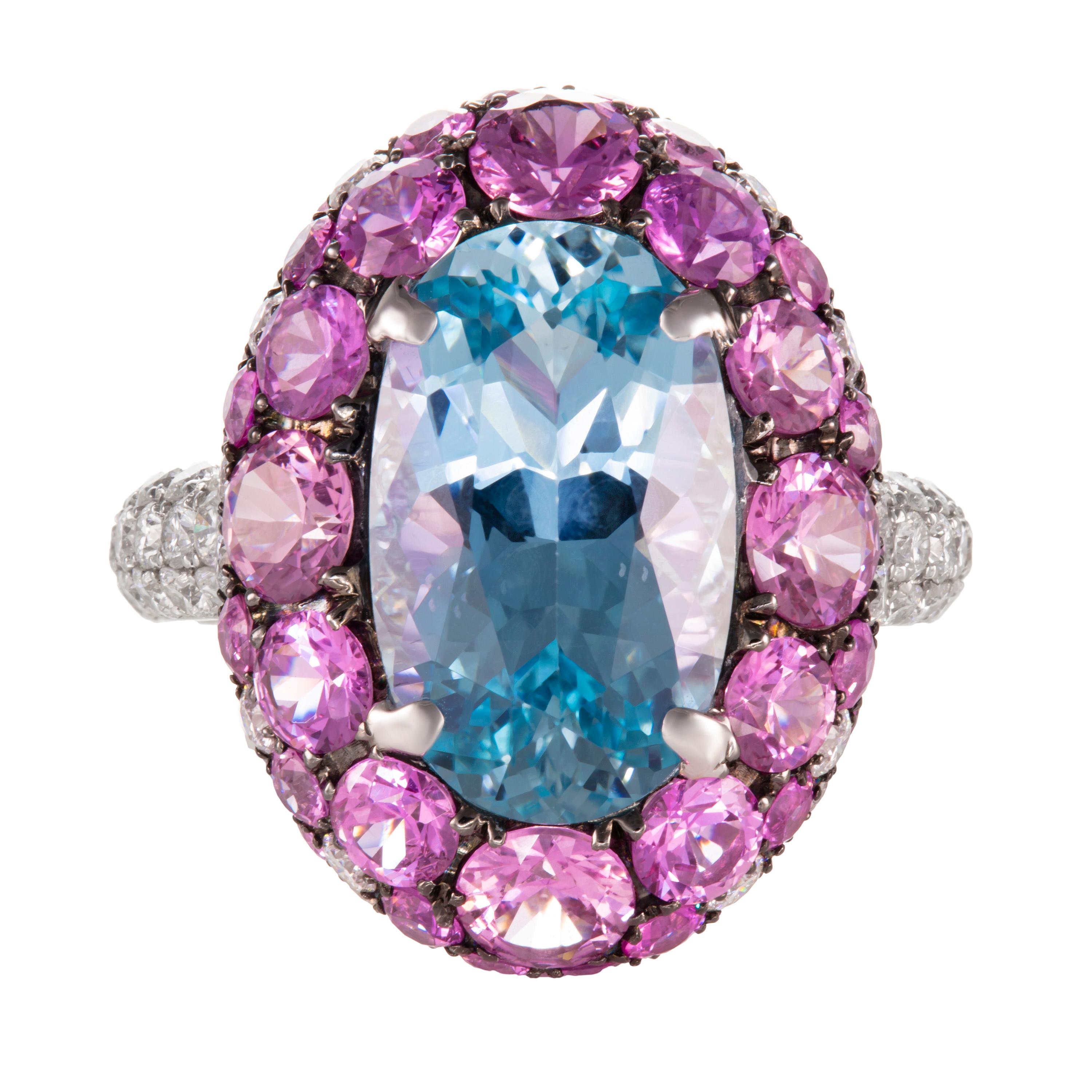 Butani's ring is crafted from 18 karat white gold. It is set with a 5.27 carat oval aquamarine and encompassed with 4.41 carats of round pink sapphires and 1.51 carats of white diamonds.  Currently a ring size US 8.  For other sizes, please contact