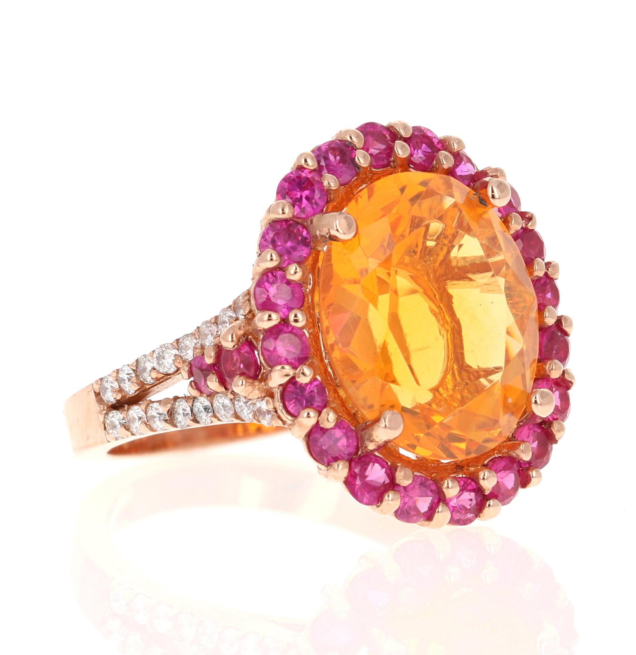 5.27 Carat Oval Cut Fire Opal Sapphire Diamond Yellow Gold Cocktail Ring

This ring has a 3.76 Carat Oval Cut Orange Fire Opal as its center stone and is elegantly surrounded by 24 Round Cut Pink Sapphires that weigh 1.20 Carats and 32 Round Cut