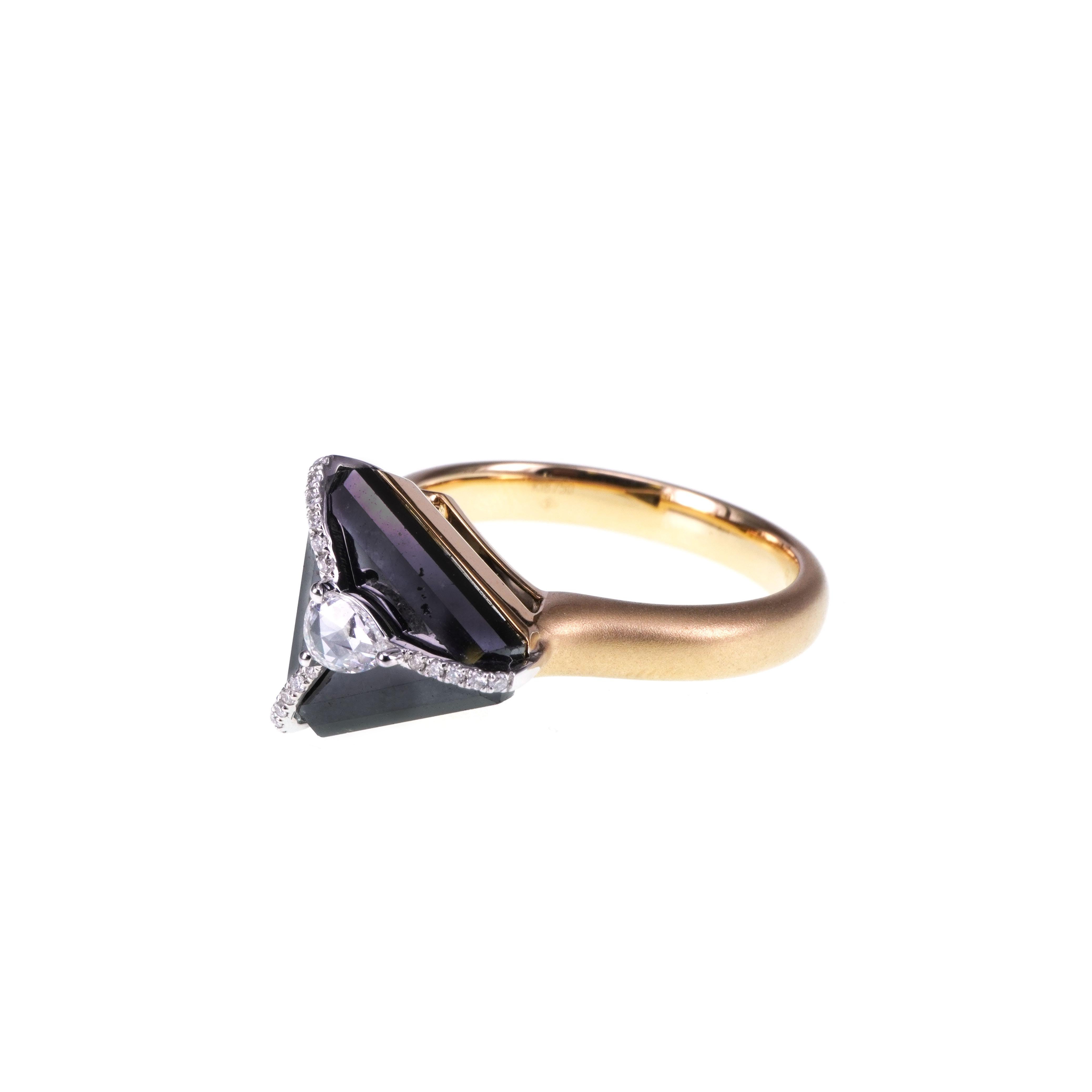 A highly saturated black diamond weighing 5.28 carats are set with 0.17 carat of white diamond in this matt finished Italian make 18 K Gold Ring.
The USP of this ring is that the way the diamond is set on the black diamond shows the highest level of