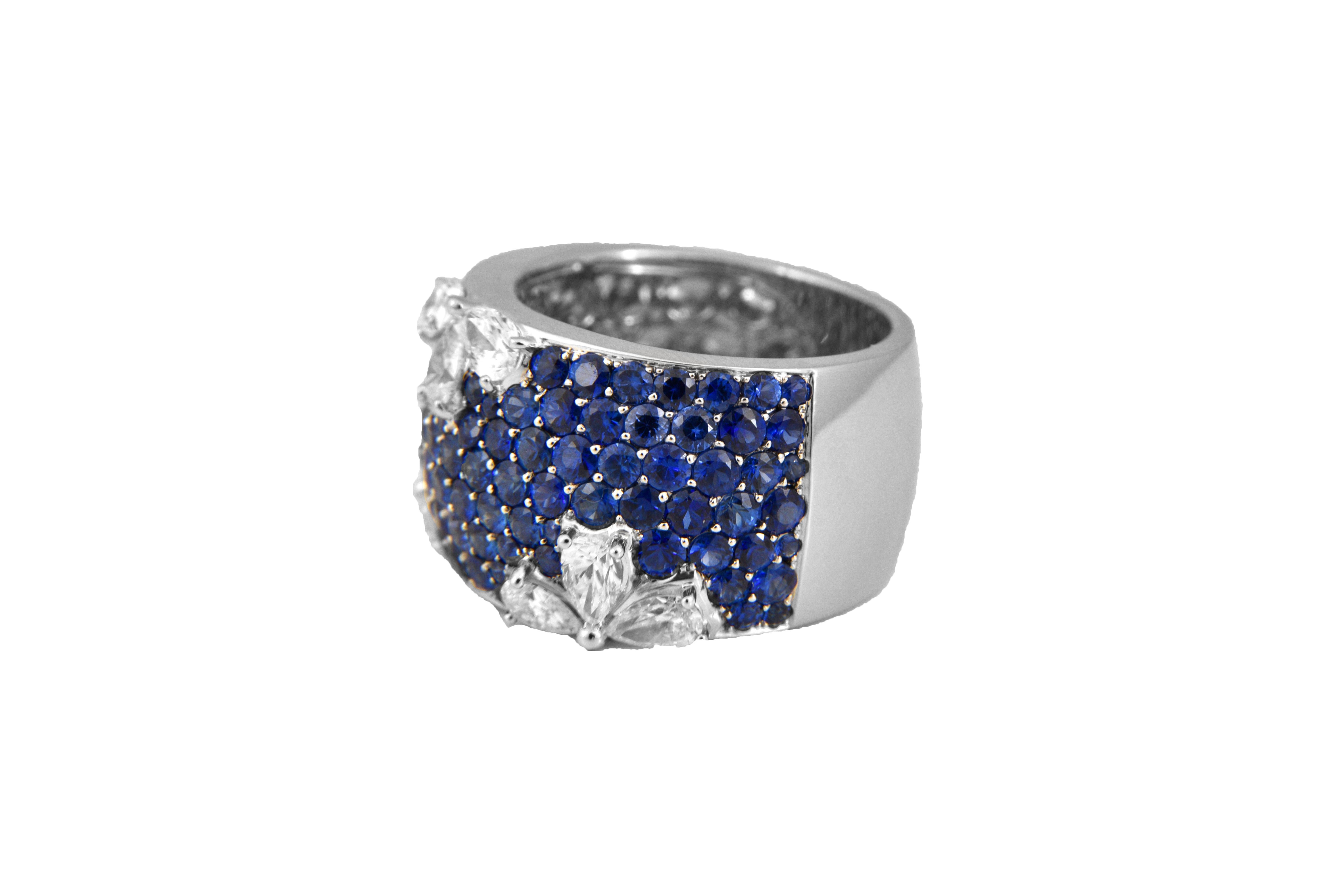 This cute ring is sure to turn heads with its 4.01 Carats of round sapphires and 1.28 Carats of Diamond. US size 6