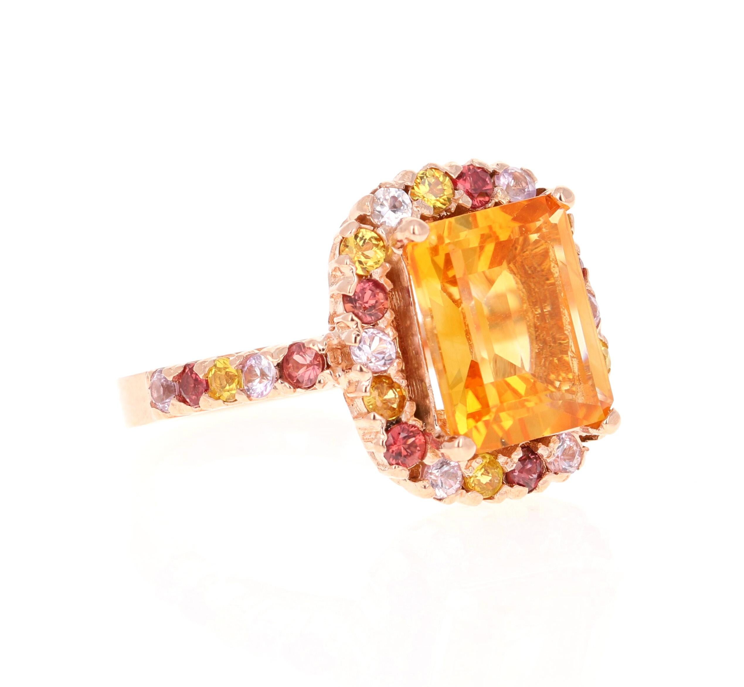 5.29 Carat Emerald Cut Citrine Sapphire Rose Gold Ring

This gorgeous ring has a beautiful Emerald Cut Citrine Quartz weighing 3.79 Carats and is surrounded by a total of 28 Multi Sapphires weighing 1.50 Carats. Each stone is handpicked and