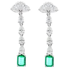 5.29 Carat Total Pear Shape Diamonds and Emerald Earrings in 14 Karat White Gold