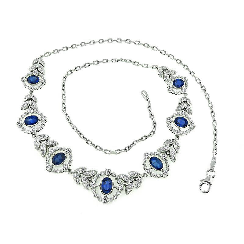 This is a gorgeous 18k and 14k white gold necklace. The necklace is set with lovely oval cut sapphires that weigh approximately 5.29ct. The sapphires are accentuated by sparkling round cut diamonds that weigh approximately 2.75ct. The color of these