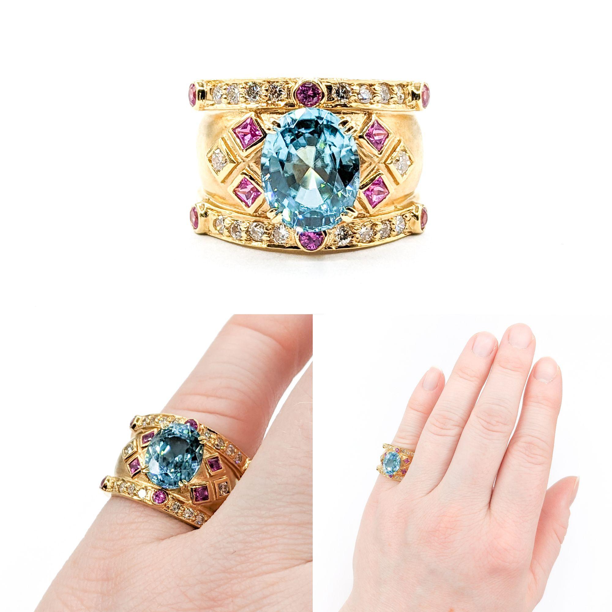5.2ct blue zircon & Diamond & .50ctw Pink Sapphire Ring In Yellow Gold

Crafted in elegant 18kt Yellow gold, this Gemstone Fashion Ring boasts a stunning 5.2ct blue zircon centerpiece, complemented by .20ctw round diamonds of SI clarity and near