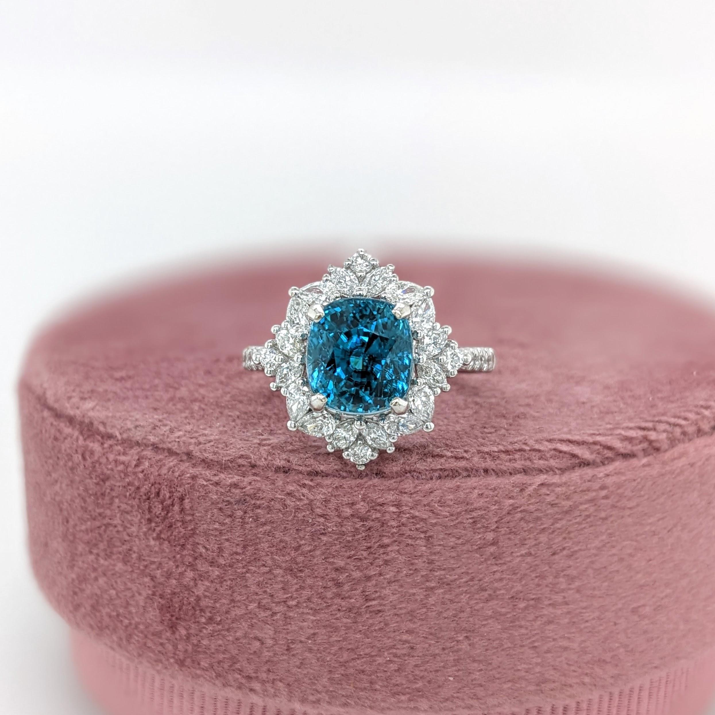 This beautiful ring features a 5.26 carat cushion shaped Blue Zircon gemstone with natural earth mined diamonds set in solid 14K gold. This Blue Zircon ring makes a lovely December birthstone gift for your loved ones! 

Specifications

Item Type: