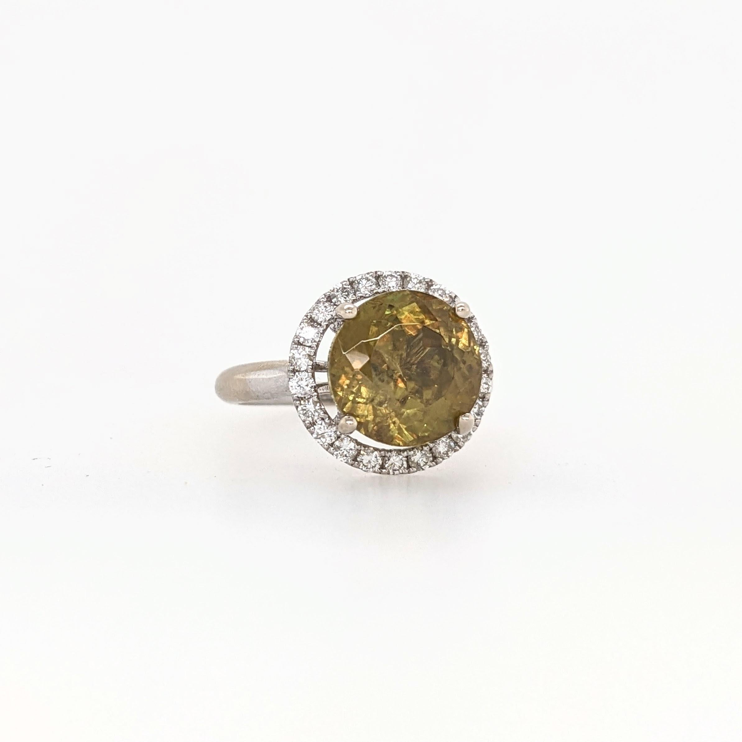 Presenting NNJ Designs' Summer Collection! 

This beautiful estate ring features a 5.29 carat round Sphene gemstone with a halo of natural earth mined diamonds set in solid 14K gold. 

Specifications

Item Type: Ring
Center Stone: Sphene
Treatment:
