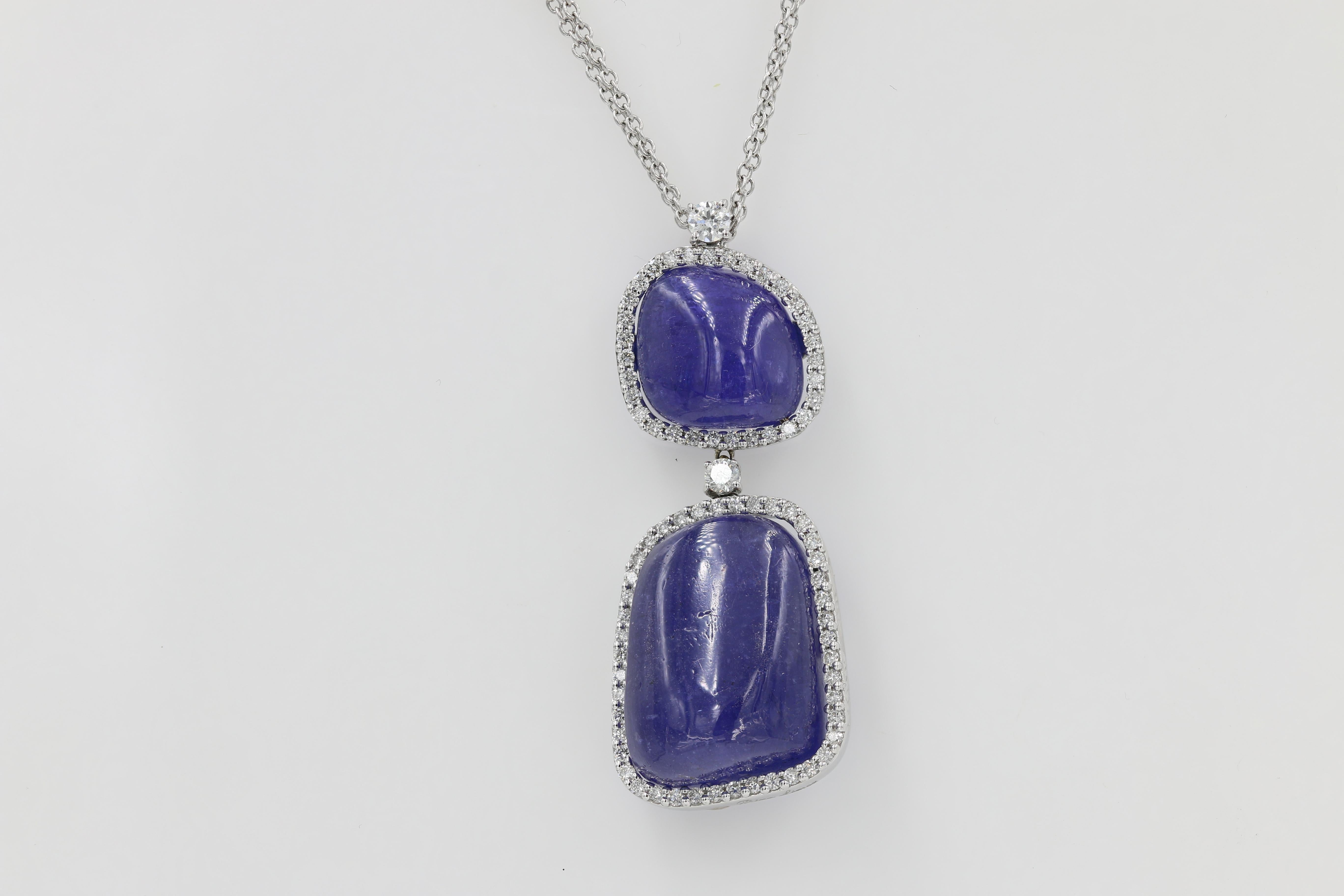 This lovely 18kt. White gold necklace features 2 Tanzanite Cabochon cuts weighing approximately 52cts. total with 77 Round diamonds weighing 0.86ct. total.	

The necklace features a double chain at 16” in length. This piece is by Rina Limor. 
