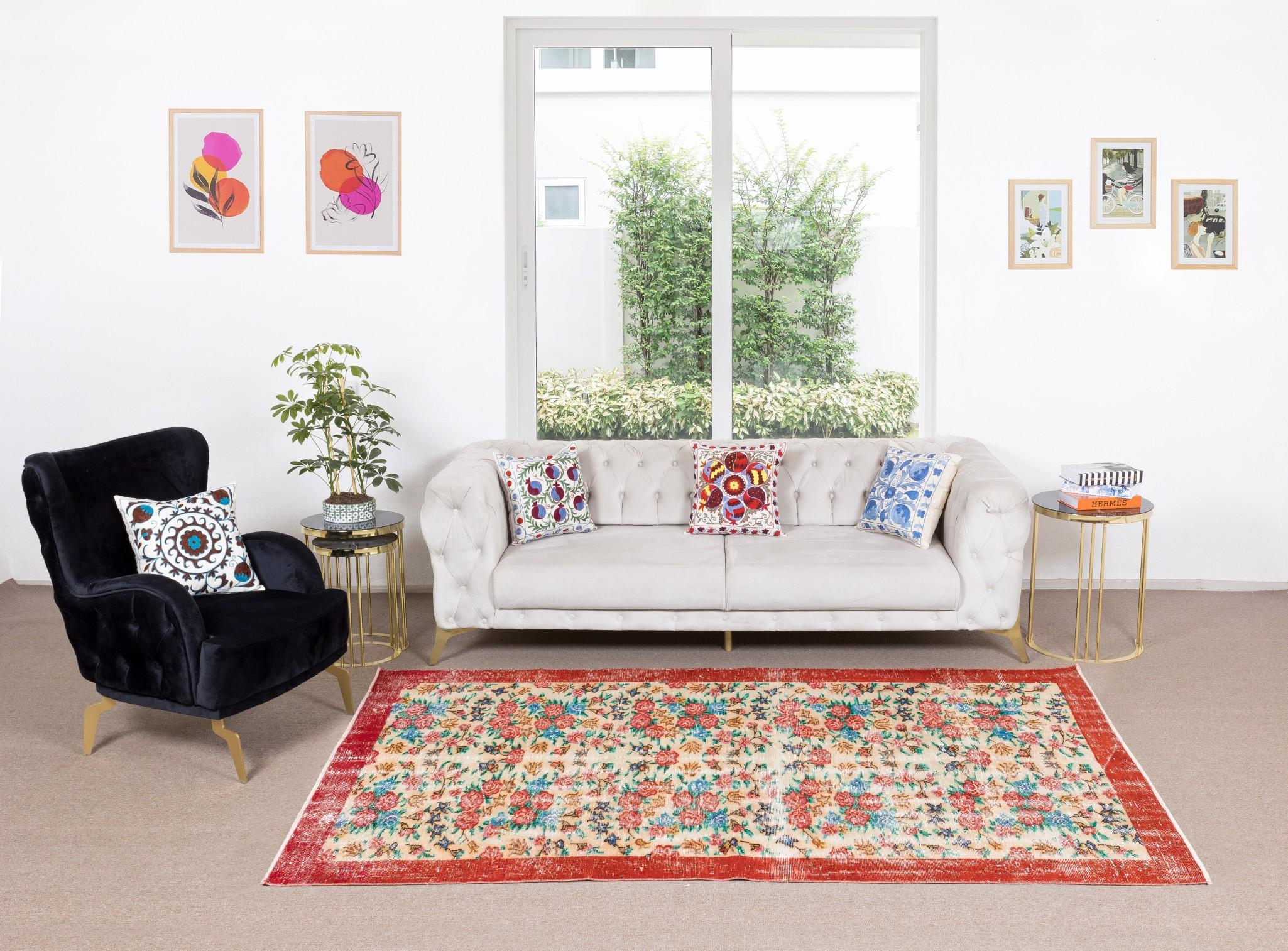 A finely hand-knotted vintage Turkish rug from 1960s featuring a floral design. The rug has even low wool pile on cotton foundation. It is heavy and lays flat on the floor, in very good condition with no issues. It has been washed professionally,