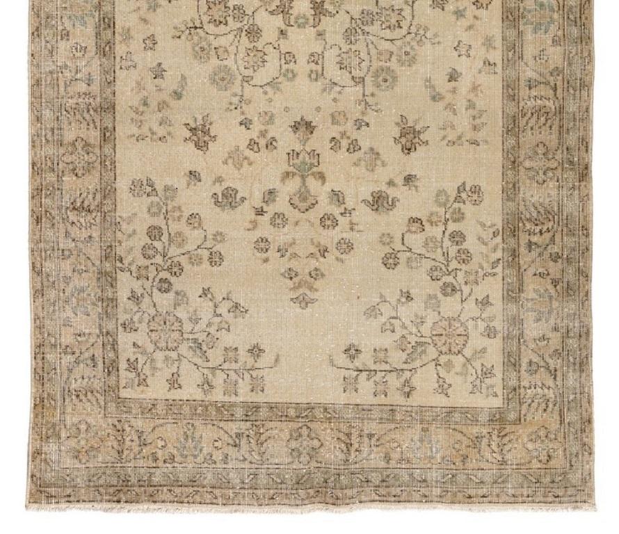Hand-Knotted 5.2x9 Ft Vintage Handmade Turkish Wool Area Rug in Muted colors on Beige ground For Sale
