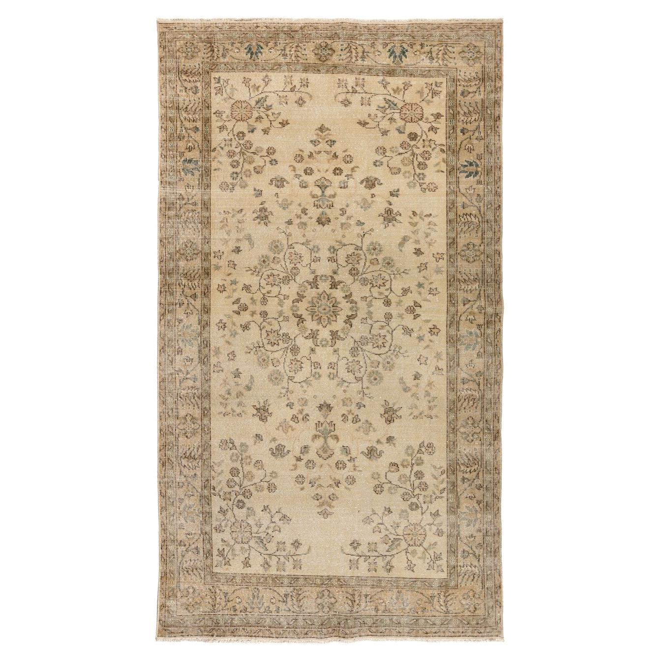 5.2x9 Ft Vintage Handmade Turkish Wool Area Rug in Muted colors on Beige ground For Sale
