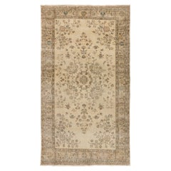 5.2x9 Ft Vintage Handmade Turkish Wool Area Rug in Muted colors on Beige ground