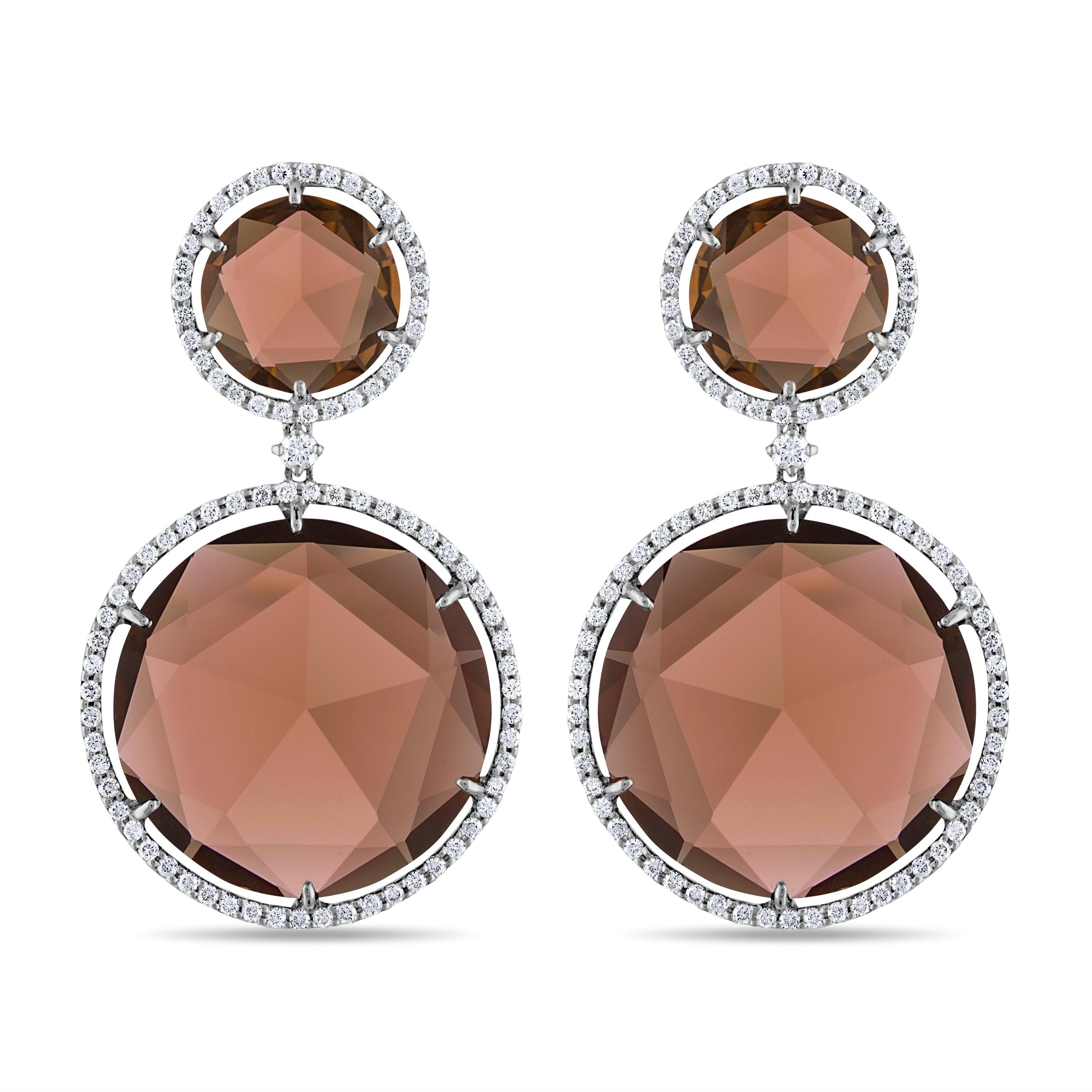 53 Carat Natural Round Rose-Cut Smoky Quartz and White Diamond Gold Earrings:

A stunning pair of earrings, it features 4 round rose-cut natural smoky quartz weighing 53 carat surrounded by white round-brilliant cut diamonds weighing 1.65 carat. The