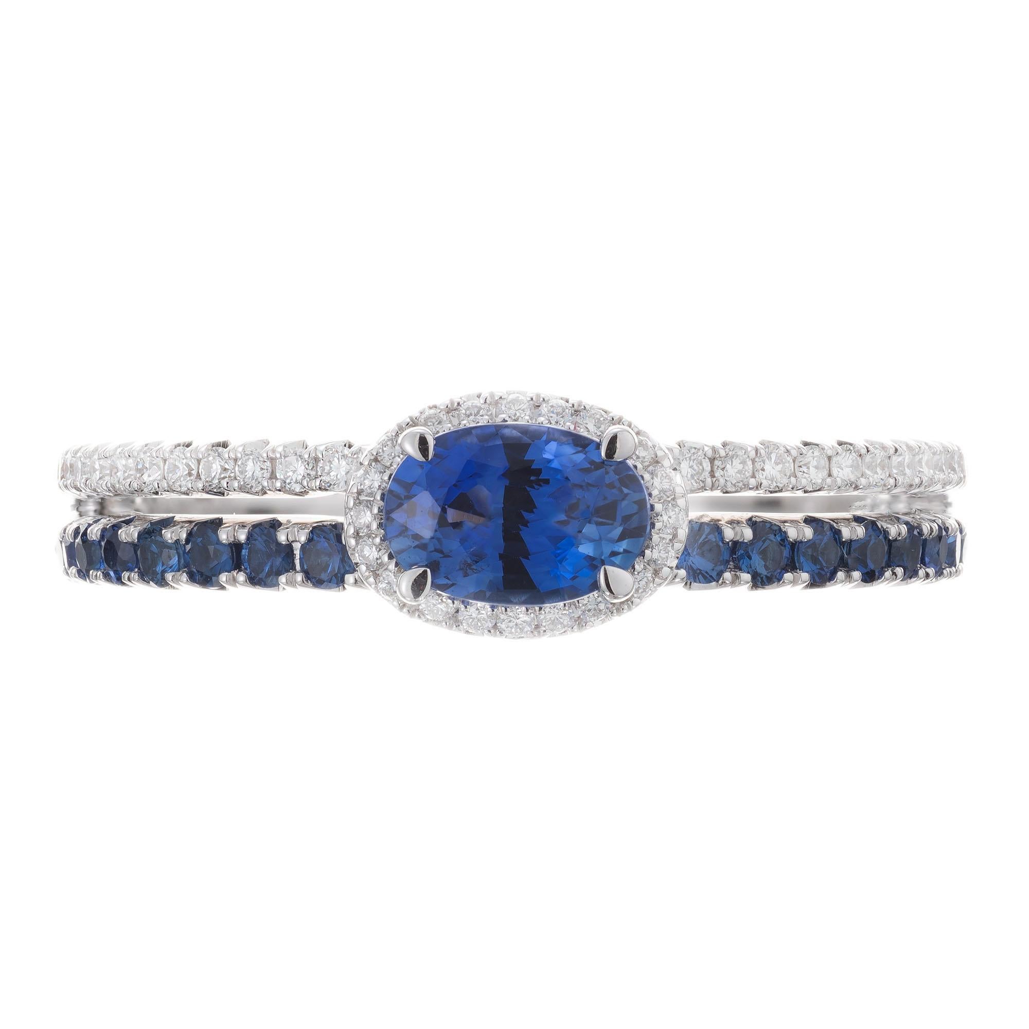 Sapphire and diamond engagement ring. Side set oval center sapphire in 14k white gold setting with round sapphires and diamonds along the split shank. 

1 oval sapphire, approx total weight. .53cts
16 round sapphires approx total weight, .32cts
14