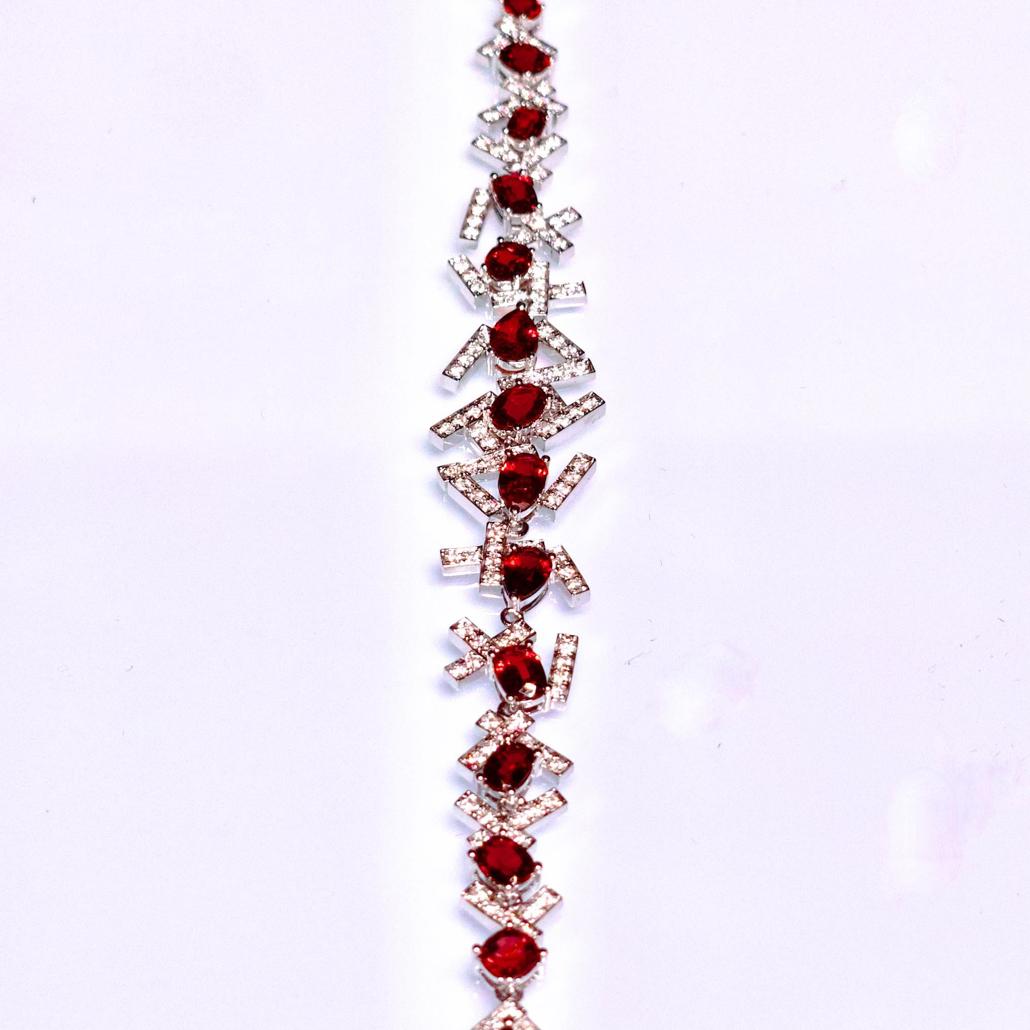 A 5.3 ct Spinel and Diamond Bracelet in 18k White Gold
It consists of 5.3 ct Intense Red Spinel of Burma origin, with no indication of heating 
Total diamond weight 1.484 ct , The Colour of the Diamond is Approximately E/F With VS Clarity
The
