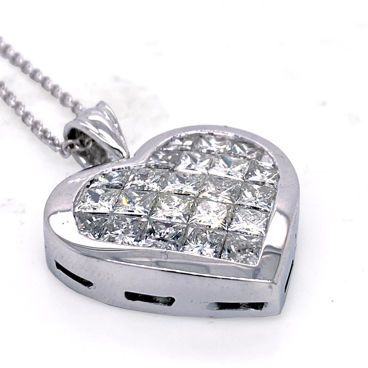 14K Gold Heart shaped Pendant with 25 Invisible Set 3.5 mm Princess Cut Diamonds with total weight of 5.30 Ct H-I/SI1-SI2). A beautiful gallery (back) allows light to go through and provide maximum shine.
Total Diamond Weight: 5.30 Ct